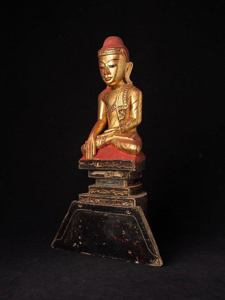 Material: wood
51,5 cm high 
31,3 cm wide and 12 cm deep
Weight: 1.721 kgs
Gilded with 24 krt. gold
Shan (Tai Yai) style
Bhumisparsha mudra
Originating from Burma
19th century
With a beautiful expression !
 