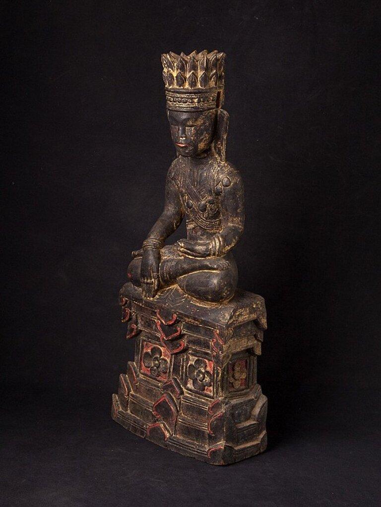 Material: wood
66,1 cm high 
27,9 cm wide and 13,3 cm deep
Weight: 6.546 kgs
With traces of the original 24 krt. gilding
Shan (Tai Yai) style
Bhumisparsha mudra
Originating from Burma
18th century.
 