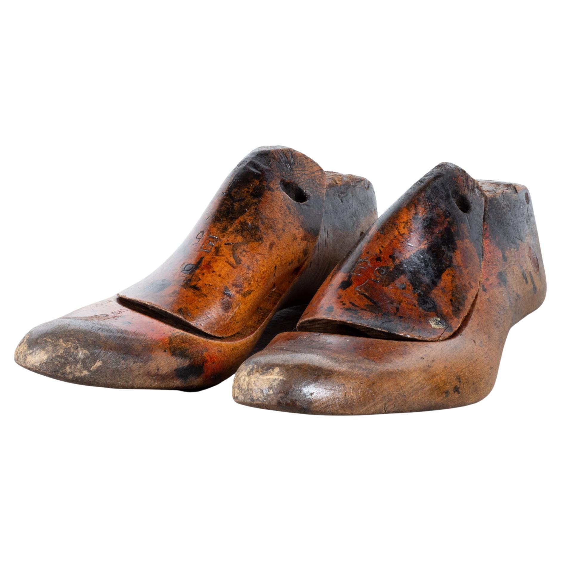 ﻿ABOUT

Price is per pair. Decorative only. Sizes unknown. Please specify which pair you would like. 

Original pairs of cobbler's wooden shoe lasts. Refinished and shellacked.

    CREATOR Unknown.
    DATE OF MANUFACTURE c.1920
    MATERIALS AND