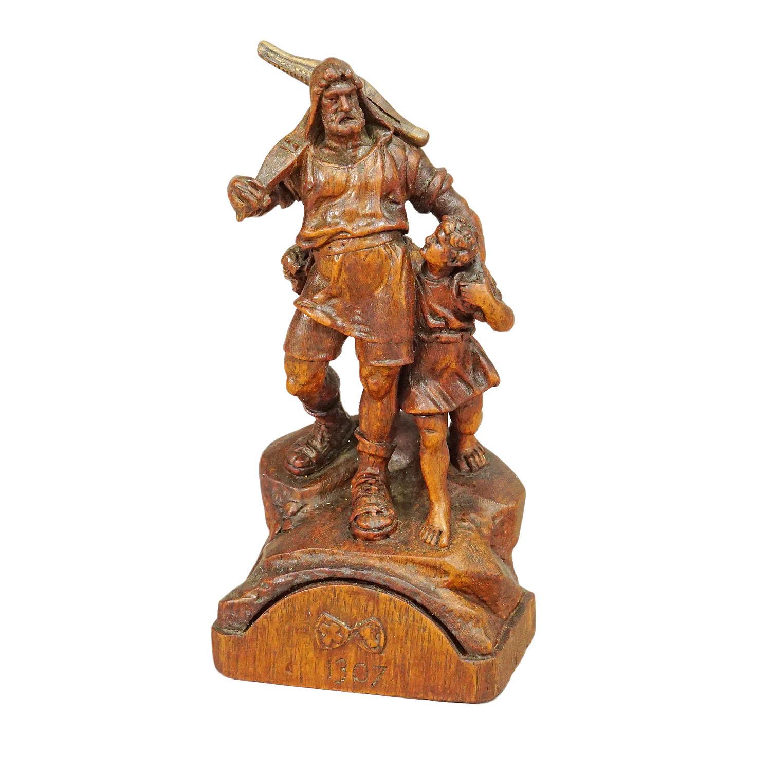 Antique Wooden Statue of Wilhelm Tell, Brienz circa 1900

A nice handcarved wooden statue featuring Wilhelm Tell and his son. It is a classical carving art made in Brienz, Switzerland circa 1900. Wilhelm Tell is a legendary Swiss freedom fighter.