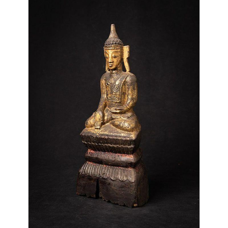 Material: wood
35,1 cm high 
14,4 cm wide and 10,5 cm deep
Weight: 1.012 kgs
Gilded with 24 krt. gold
Shan (Tai Yai) style
Bhumisparsha mudra
Originating from Burma
18th century.
 