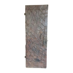 Antique wooden tower door covered in iron, 19th century Italy