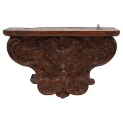 Used wooden wall mounted carved console, France ca. 1850