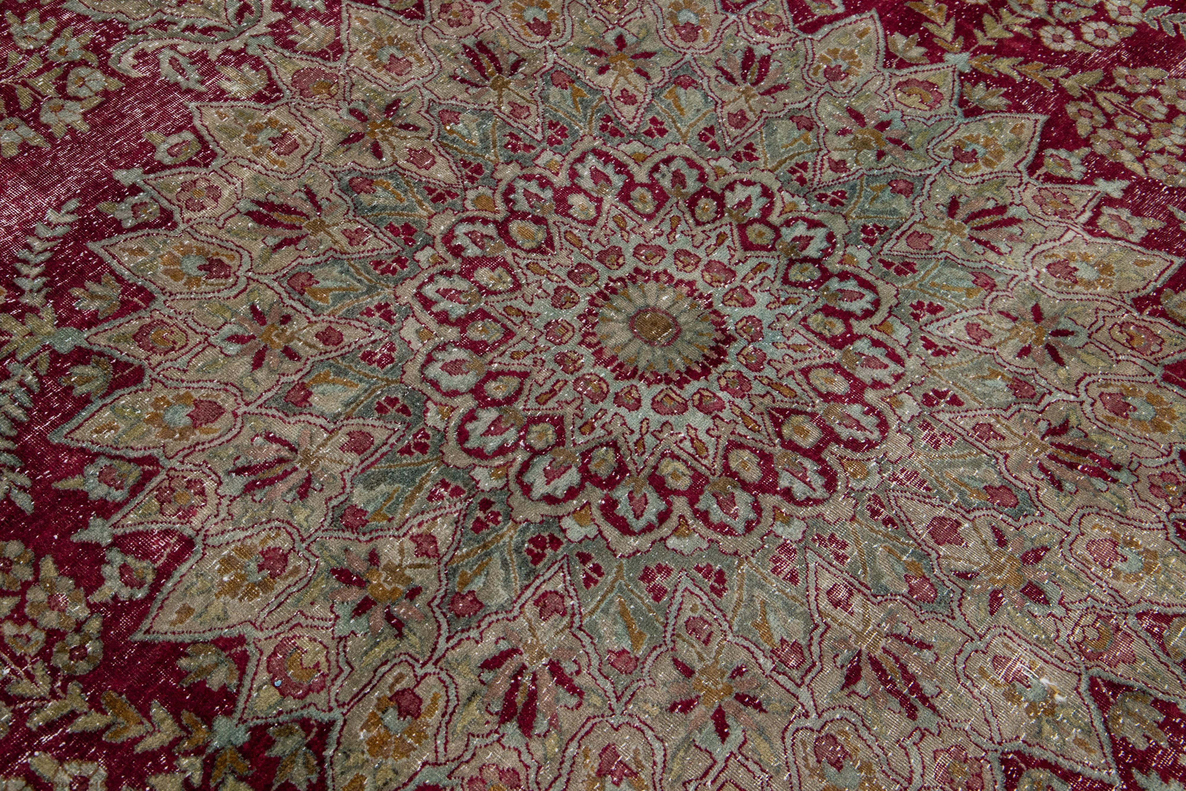 Antique Wool Rug Persian Kerman featuring a Medallion Floral Motif  In Good Condition For Sale In Norwalk, CT