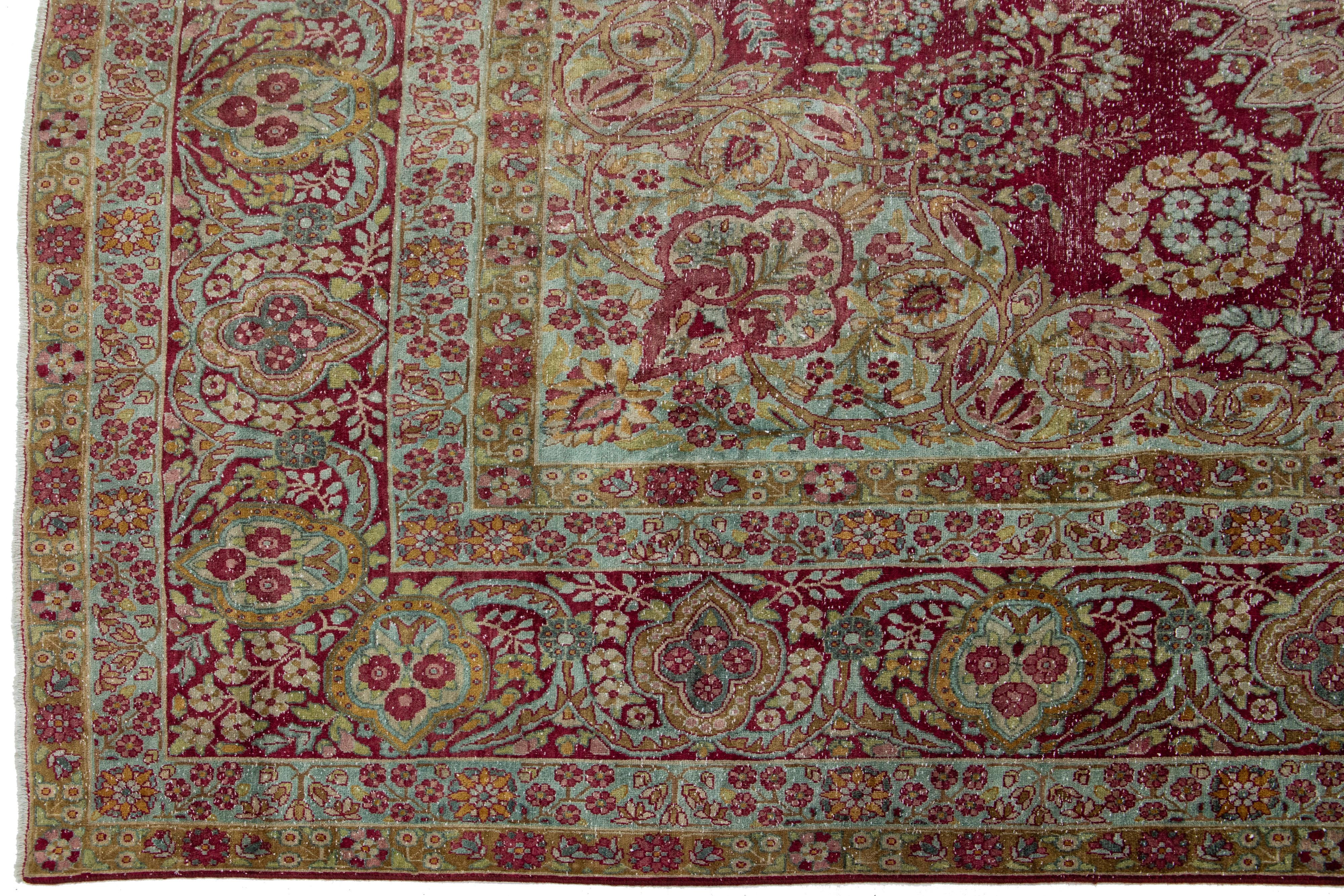 Antique Wool Rug Persian Kerman featuring a Medallion Floral Motif  For Sale 1