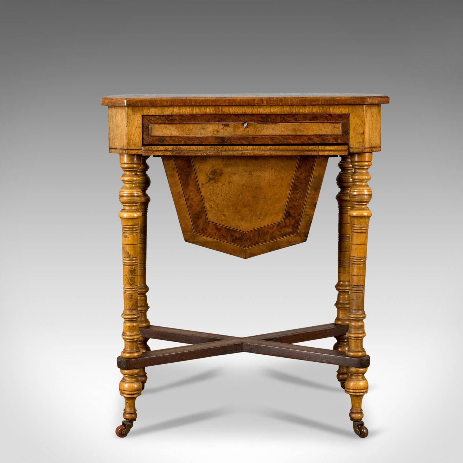 This is an antique work table, a Regency sewing table in burr walnut and amboyna, English dating to circa 1820 and later.

Burr walnut and amboyna with attractive grain interest and a desirable aged patina 
Good consistent colour in a waxed