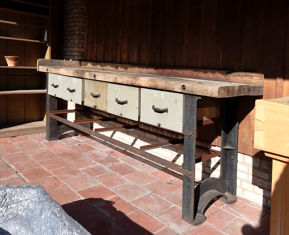 A beautiful antique workbench from the 19th century 
recuperated out of a Dutch farm.
With the original paint, I presume a pitch pine top and
5 large drawers with original handles.

Used in a farm workshop in the Netherlands.