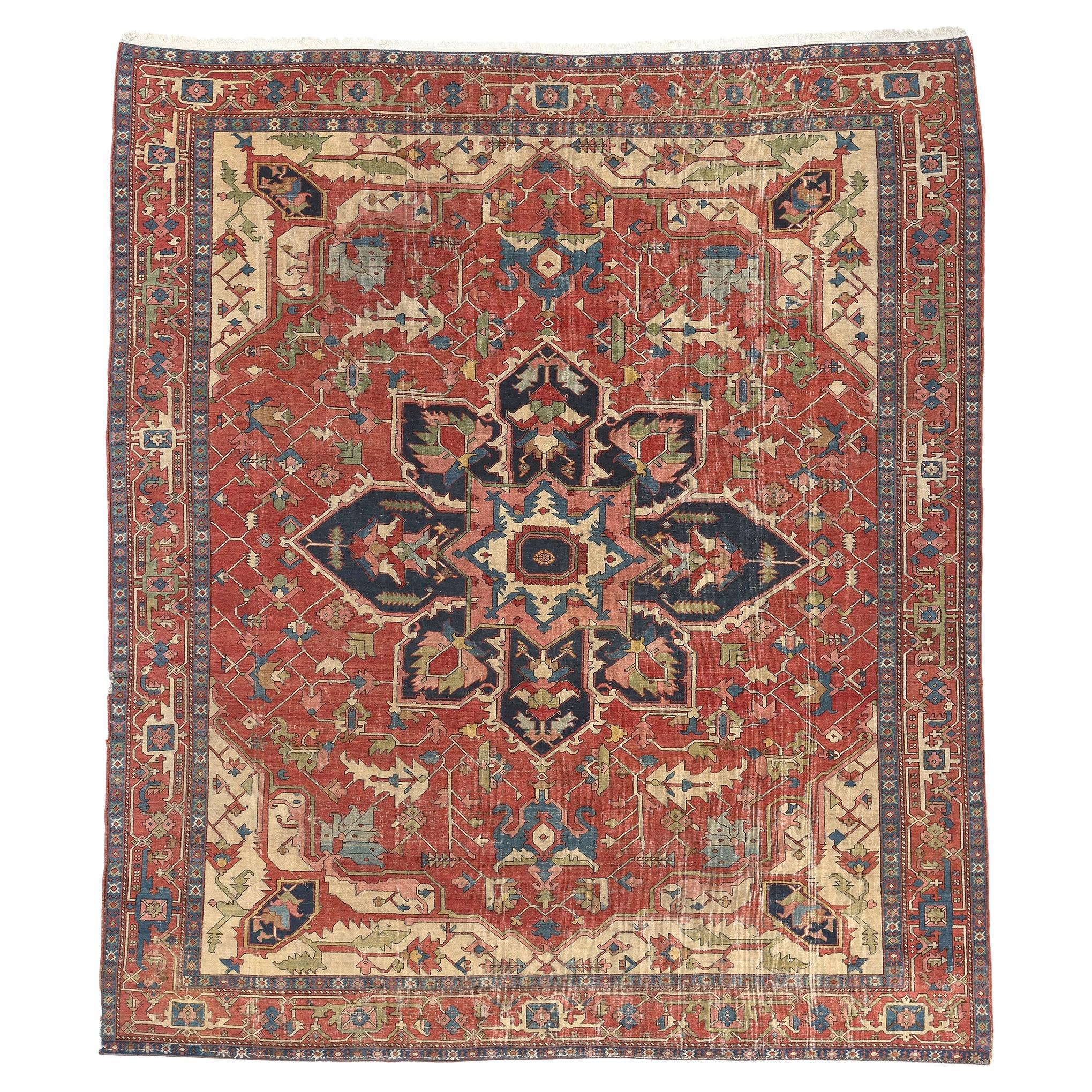 Antique-Worn Persian Serapi Rug, Rustic Finesse Meets Ivy League Prep Style For Sale