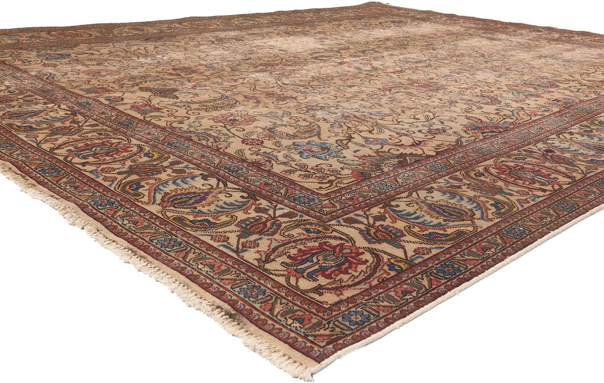 74332 Antique-Worn Persian Tabriz Rug, 09'07 x 12'03.
Weathered beauty meets rustic sensibility in this hand knotted wool antique-worn Persian Tabriz rug. The faded botanical design and warm earthy hues woven into this piece work together resulting