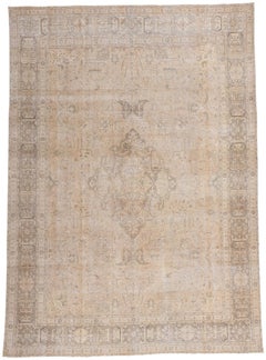 Antique-Worn Persian Tabrz Rug, Weathered Finesse Meets Tonal Elegance