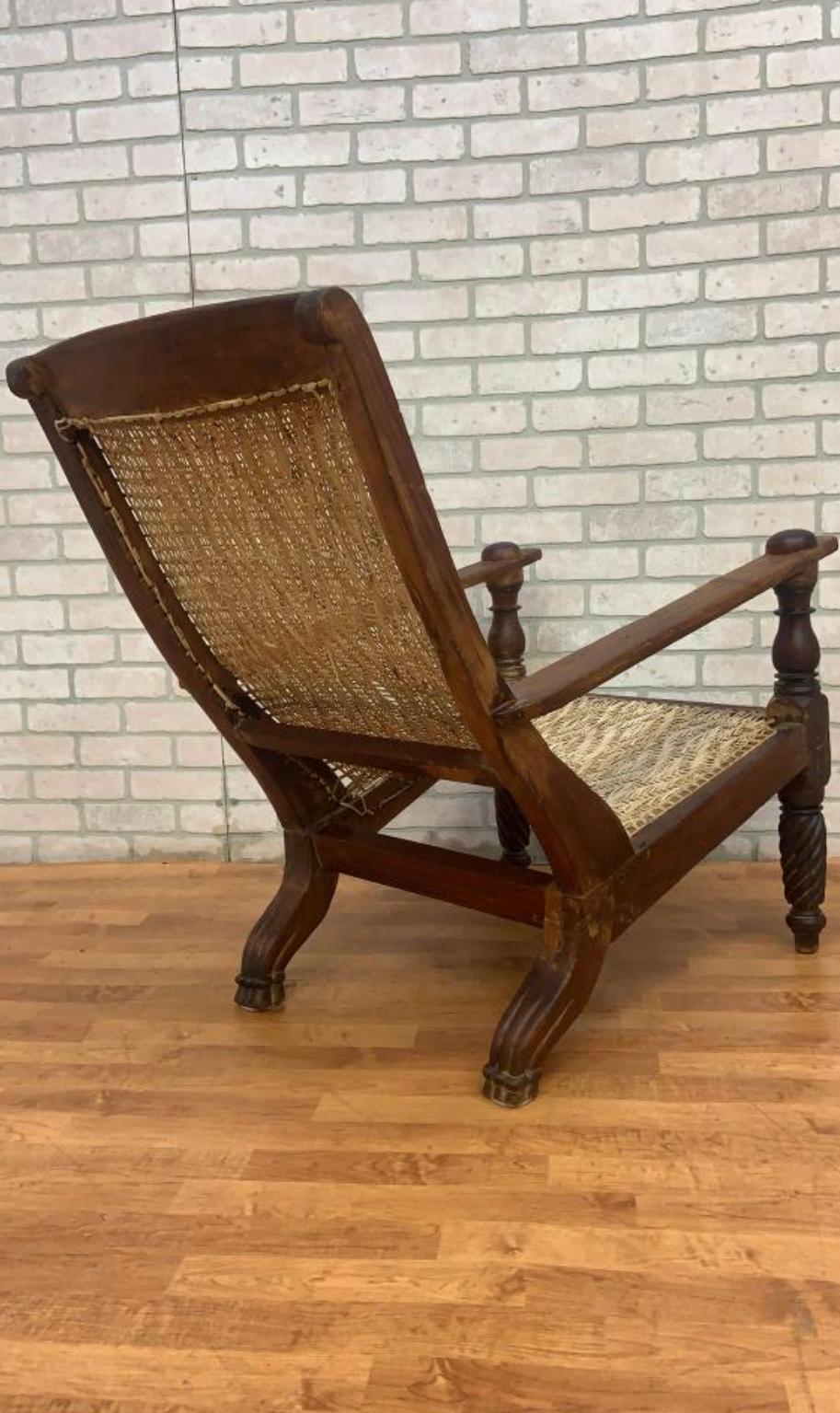 Antique Woven Back British Colonial Plantation Tea Chair

This late 19th Century antique British Colonial plantation tea chair is a great lounge chair sure to heighten any decor. The chair has beautifully carved legs and an arched woven rattan