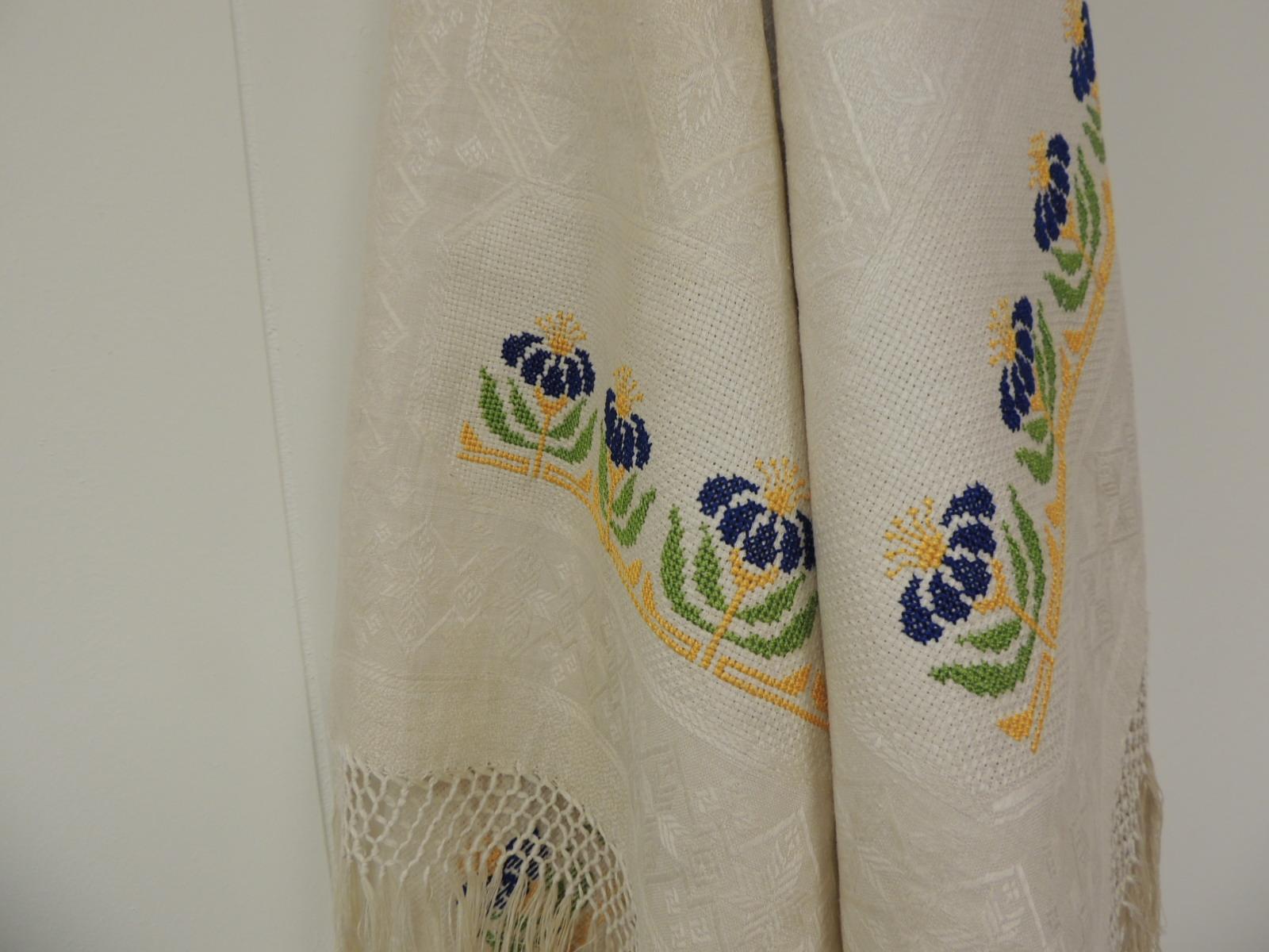 Antique woven floral Turkish towels with hand-knotted fringes.
Jacquard texture depicting flowers and embroidered floral border. In shades of ecru, blue, yellow and green.
Size: 25 W x 60 L.
 