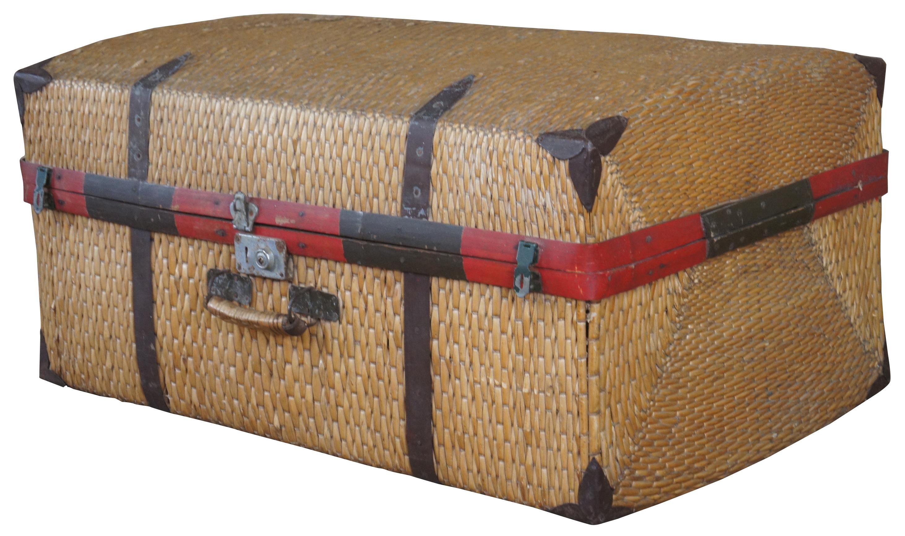 Antique woven rattan bamboo suitcase featuring a red, green and brown bentwood seam and metal hardware to protect the corners. Measures: 34