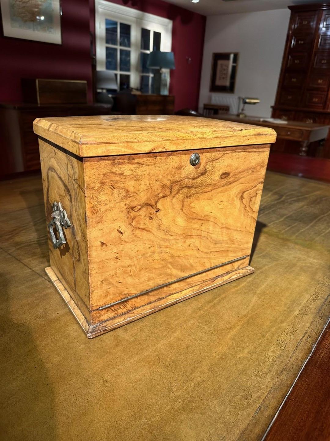 A top quality example of a late Victorian writing box.
This example is made of beautiful olive wood with sturdy cast copper handles on both sides,
The fold-down front reveals the beautifully decorated interior; when the front drops down, the