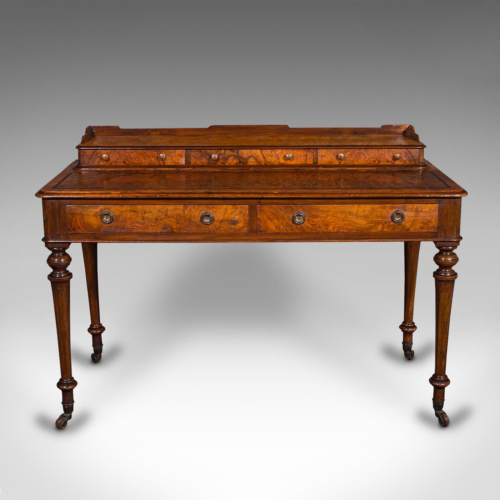 This is an antique writing desk. An English, burr walnut correspondence table, dating to the mid Victorian period, circa 1860.

The essence of mid Victorian elegance with strikingly figured appearance
Displays a desirable aged patina and in good