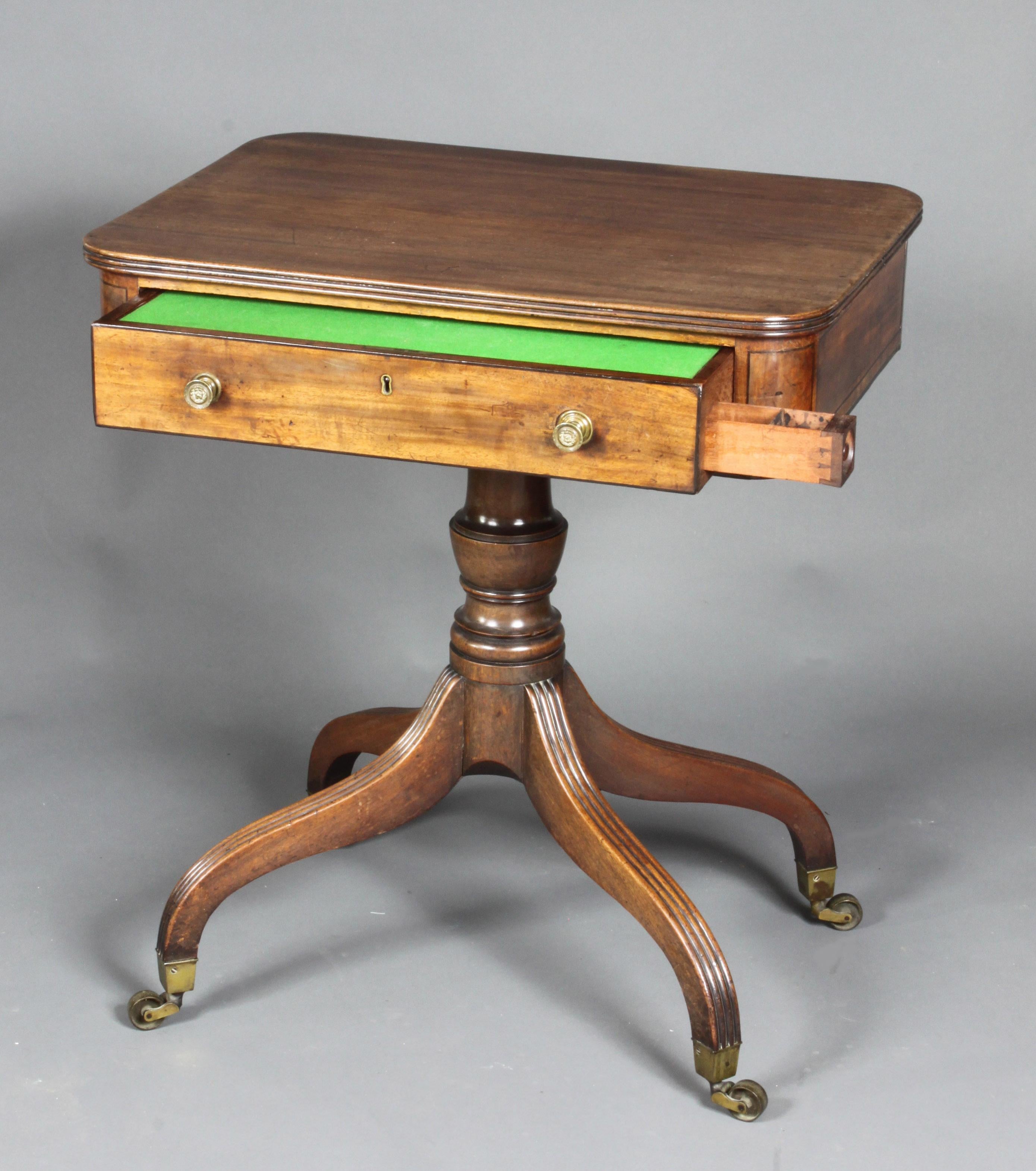A good Regency mahogany occasional table or writing table on a four-splay base. The drawer pulls out and the top hinged section slants for writing on; there is also a small ink drawer