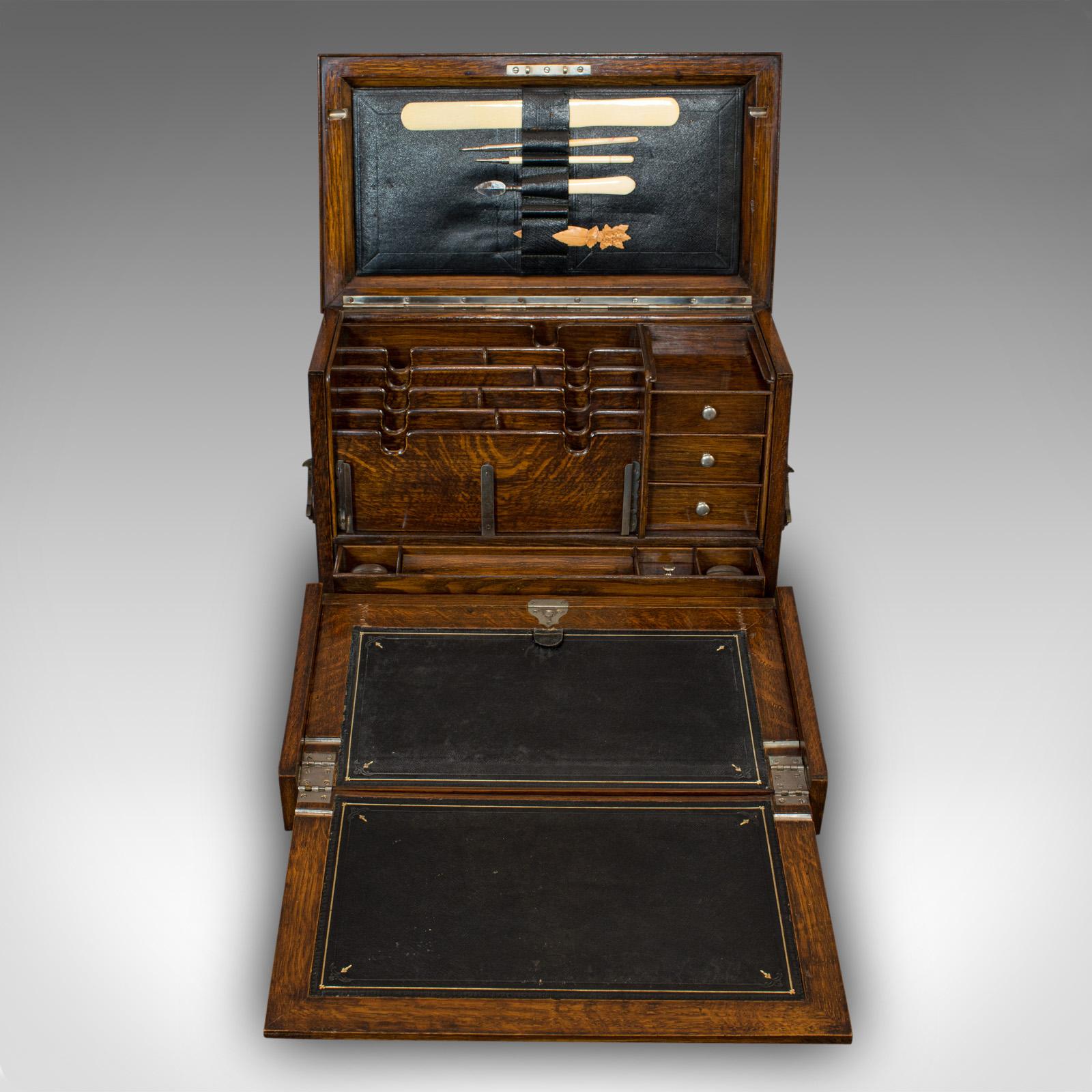 This is an antique writing slope. An English, oak travelling correspondence box, dating to the Edwardian period, circa 1910.

Quality writing slope encased in superb stocks of oak
Displays a desirable aged patina
Select oak shows fine grain