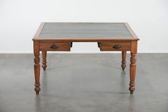 Antique writing table / partner desk with 4 drawers and a green leather top