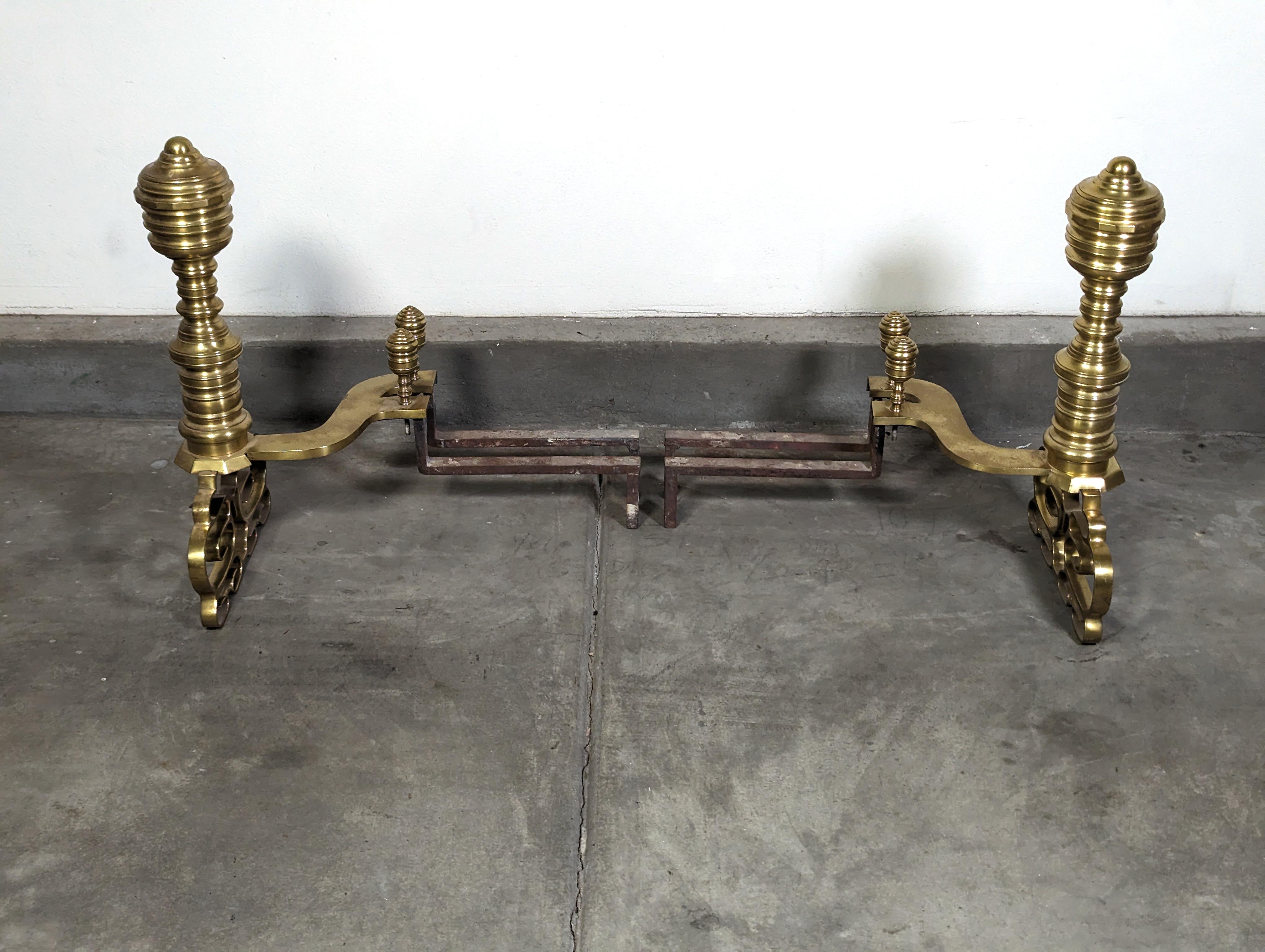 Step back in time with these exquisite late 19th-century antique brass andirons, a true testament to the craftsmanship of a bygone era. As you gaze upon these regal fireplace guardians, you're immediately drawn to the distinctive beehive design,