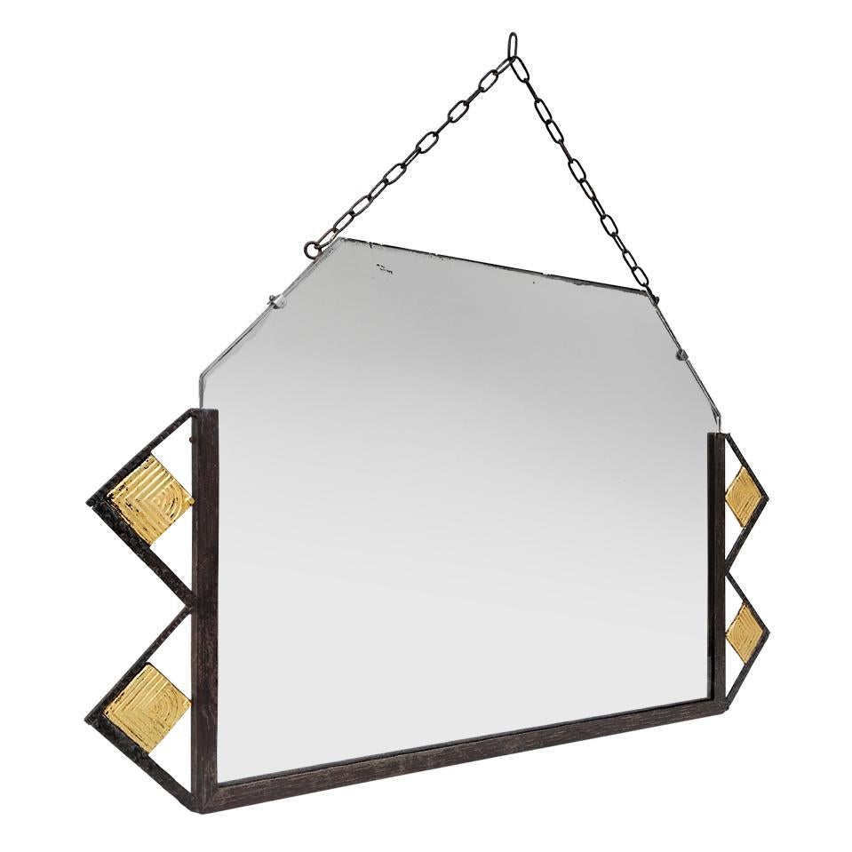 Antique french wall mirror, wrought iron and gilded with leaf, Art Deco period circa 1930. Ornaments in forged and hammered iron, patinated by time. Gilding on geometric square shapes. Original metal hanging chain. Antique glass mirror. Antique wood