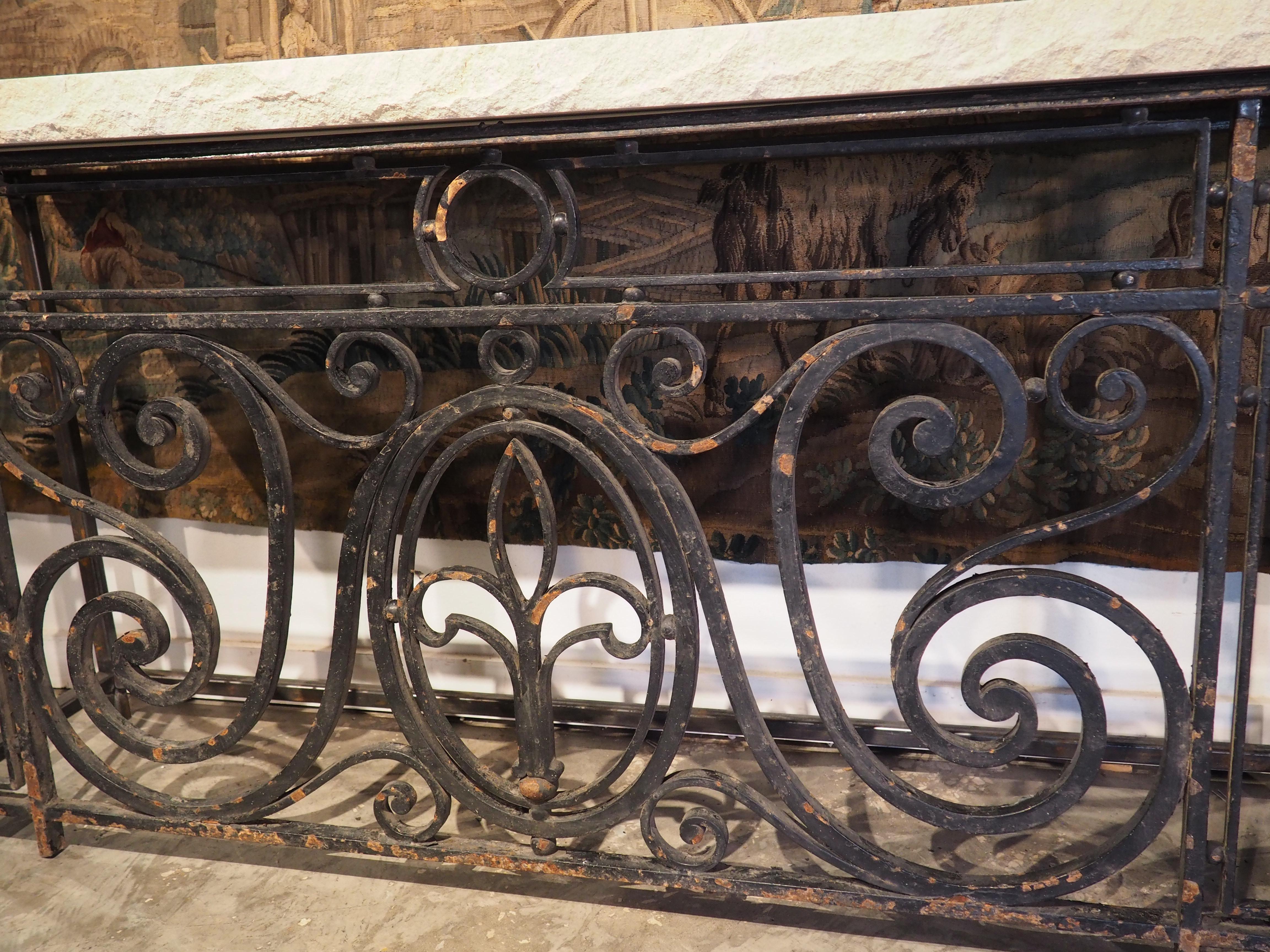 Originally serving as a balcony barrier on a French-style building in Argentina, this wrought iron railing was produced in the early 1900’s. We have repurposed the iron into a console table with a hand-cut pitched limestone top. At over two inches