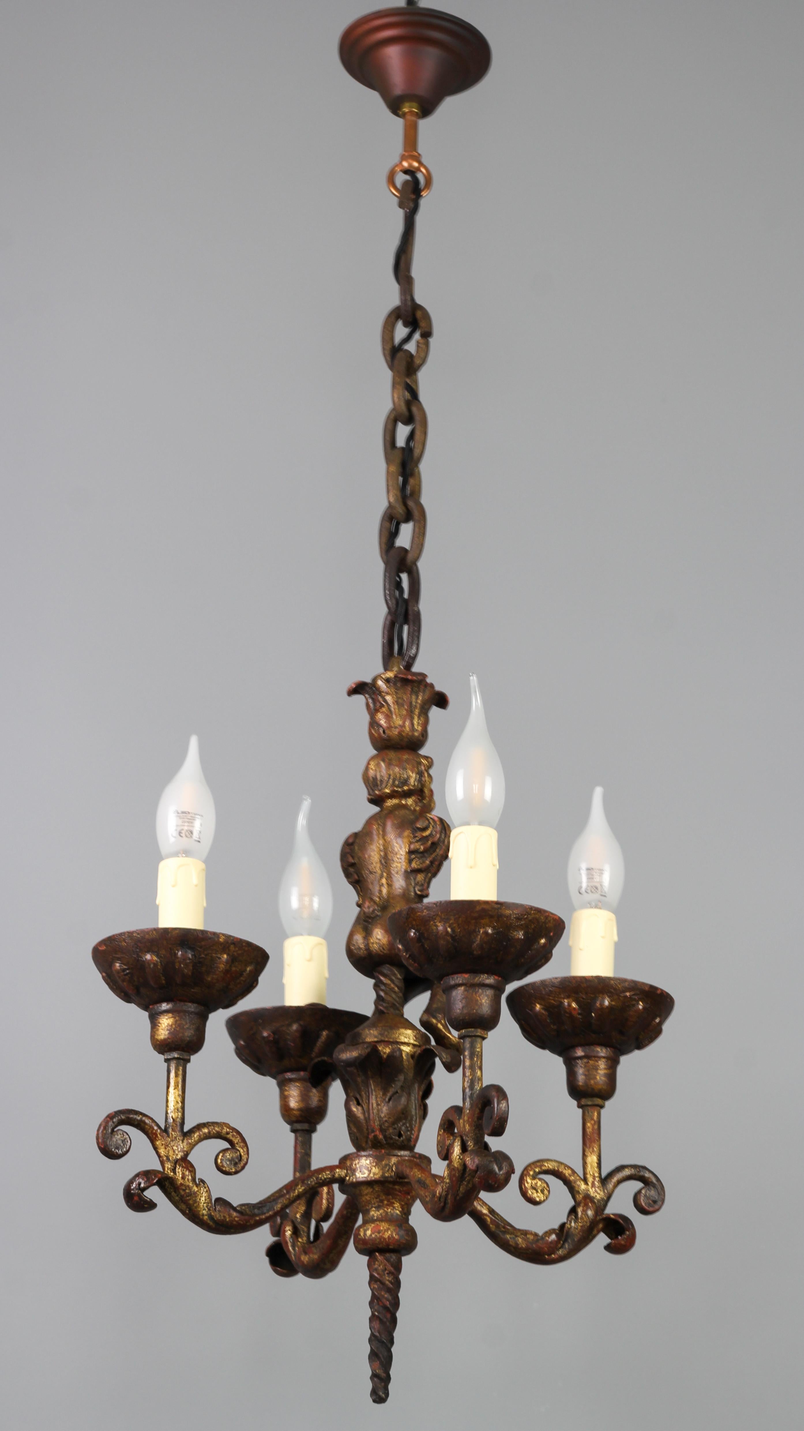 Patinated Antique Wrought Iron Baroque Style Four-Light Figural Chandelier, France For Sale