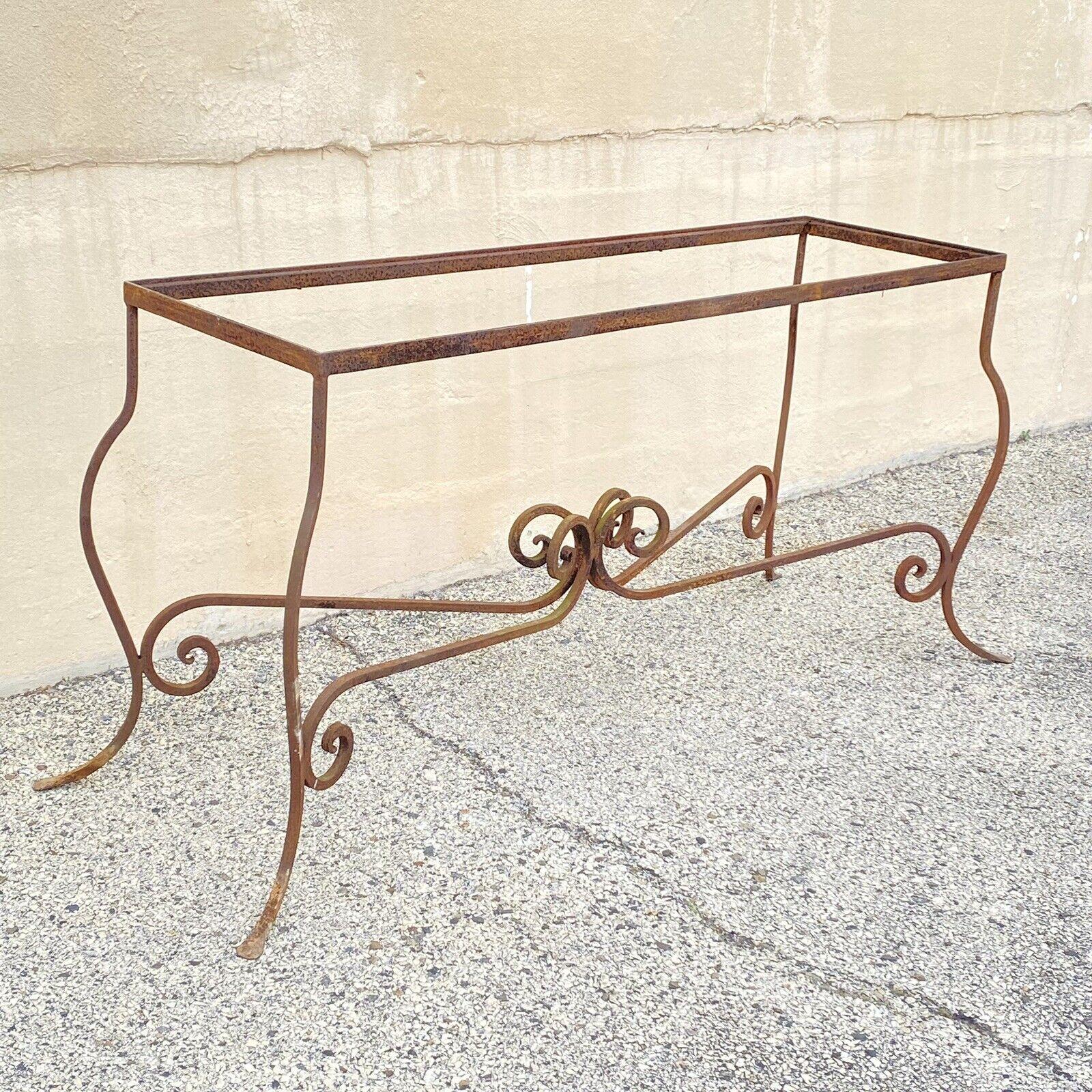 Antique Wrought Iron French Pastry Style Scrolling Garden Long Console Table. Item features a heavy wrought iron construction, stretcher base, rusty brown finish, long impressive form, very nice vintage item. Circa Mid to Late 20th