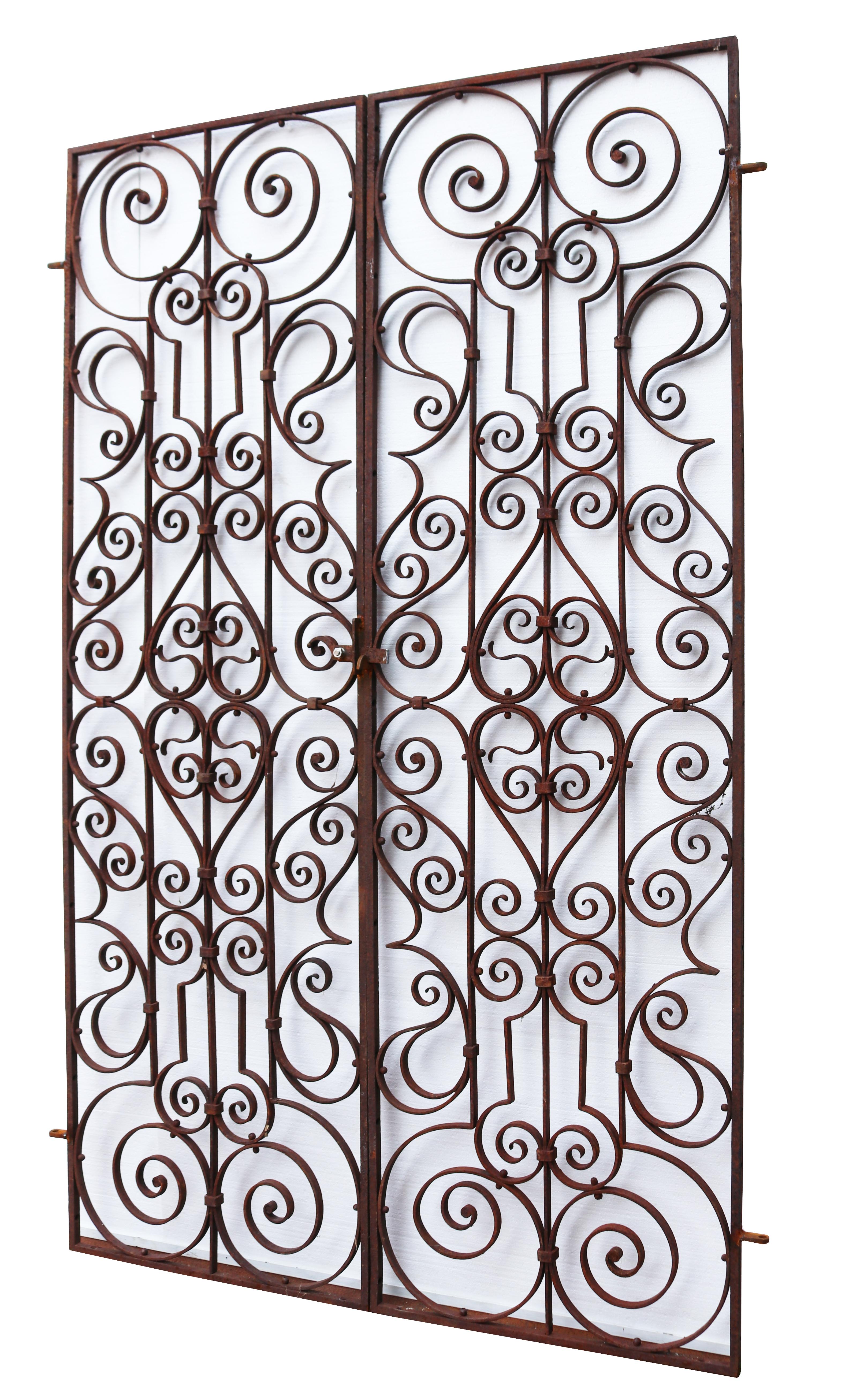 A pair of large reclaimed early 19th century iron gates with a scrolling pattern

Additional Dimensions

To fit an opening of approximately 149 cm