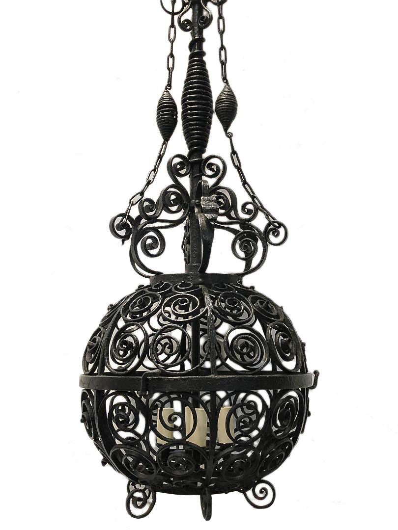 A circa 1900 American forged iron lantern electrified with interior lights and scrolling details.

Measurements:
Height 36
