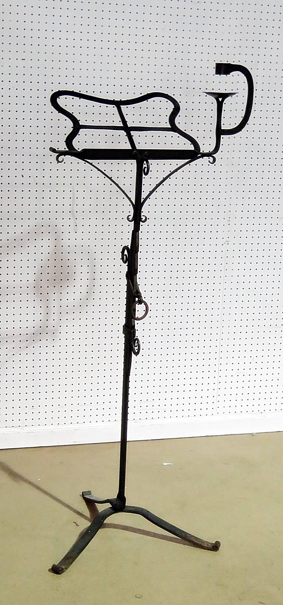 Antique wrought iron music stand with candleholder attributed to Samuel Yellin.