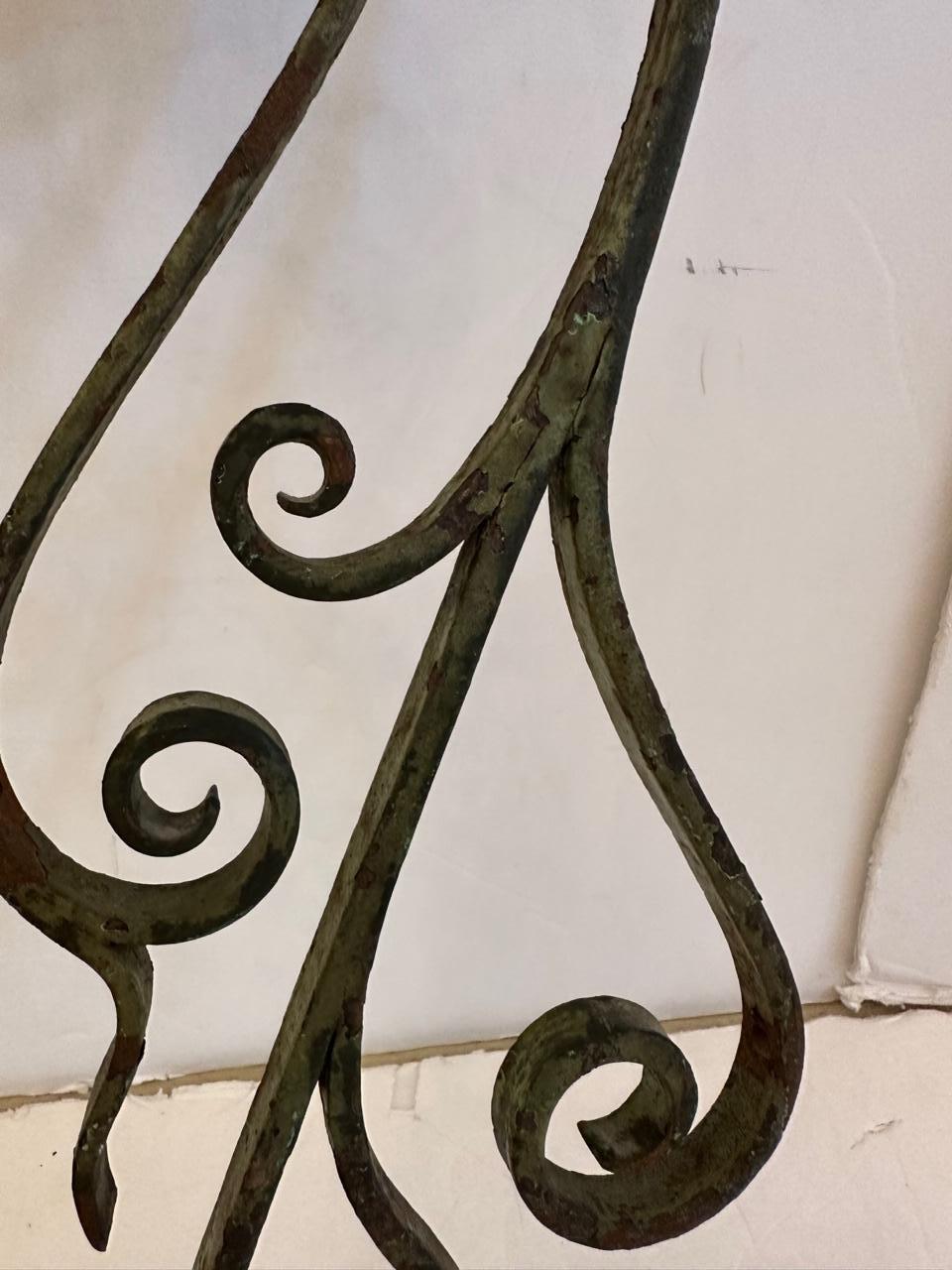 Pair of antique custom aged wrought iron wall sconces having lovely curlicues and shades.
Sconces
35.5” H to top of shade
Shade: 18.5” W at bottom 11” H x 6.5” D
Iron sconce 7.5” W x 25” H