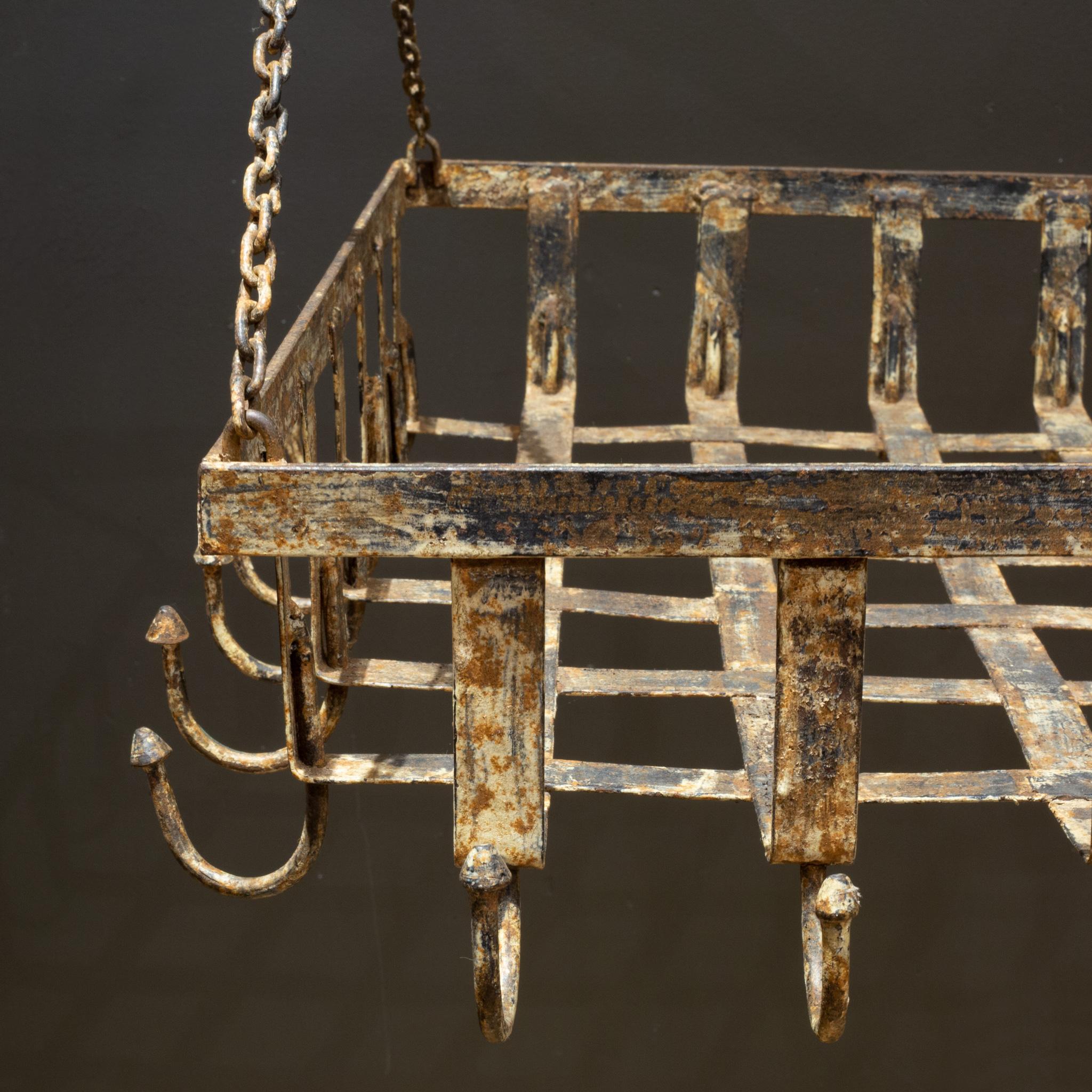 ABOUT

A large rectangular, wrought iron pot rack with lattice frame and 34 hooks. Four chains, one on each corner. Can be hung by each chain or bring together in the center.

    CREATOR Unknown.
    DATE OF MANUFACTURE c.1920-1940.
    MATERIALS
