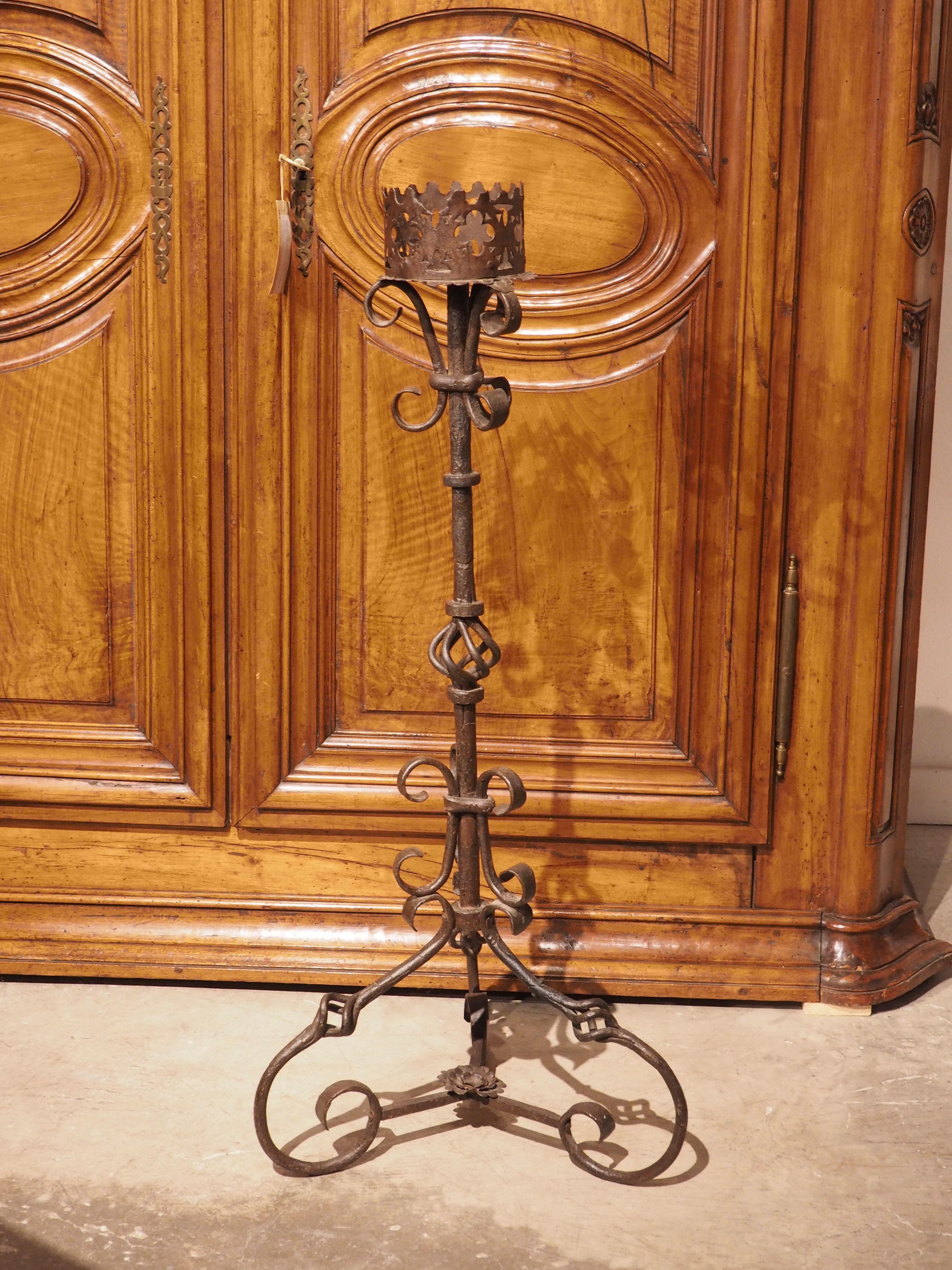 In the Middle Ages, servants often held lit torches in their hands, allowing the flame to brighten the room. During the Renaissance period the torchere was introduced, becoming a safer and more decorative technique of illumination. Our wrought iron
