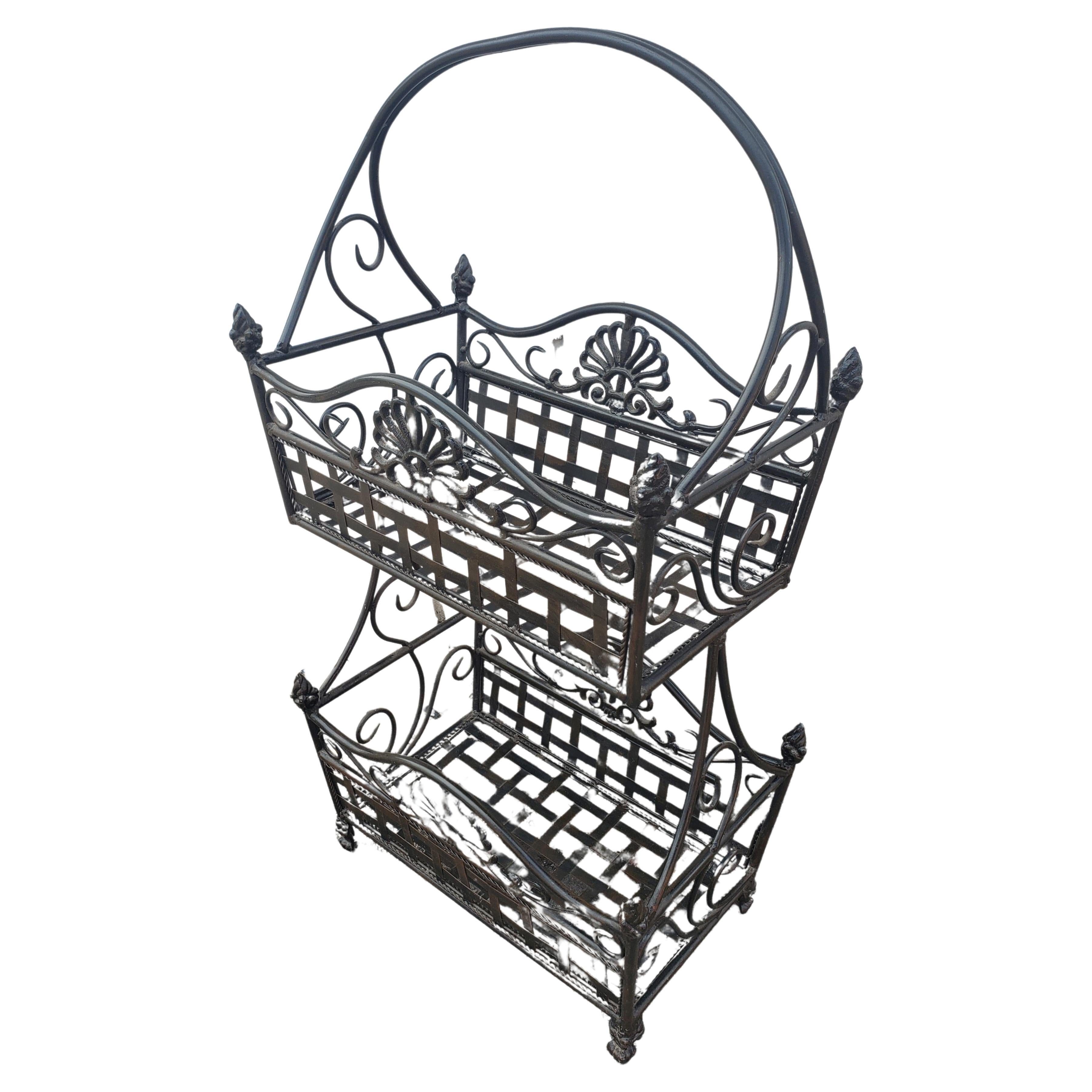 Antique two tier wrought iron 2 tier standing basket in excellent condition. 
Solid Iron with great stability. For Indoor and outdoor use. 
Measures 16.5