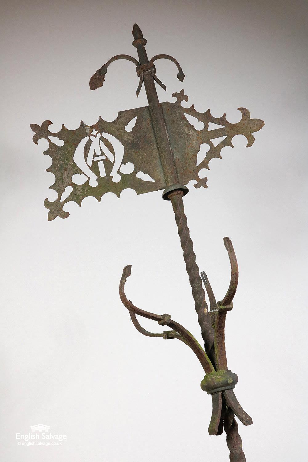 Reclaimed antique wrought iron weathervane with a barley twist central pole and intricately designed Directional arrow (which is 59cm wide). Some loss and wear throughout and the cardinal point letters are missing.