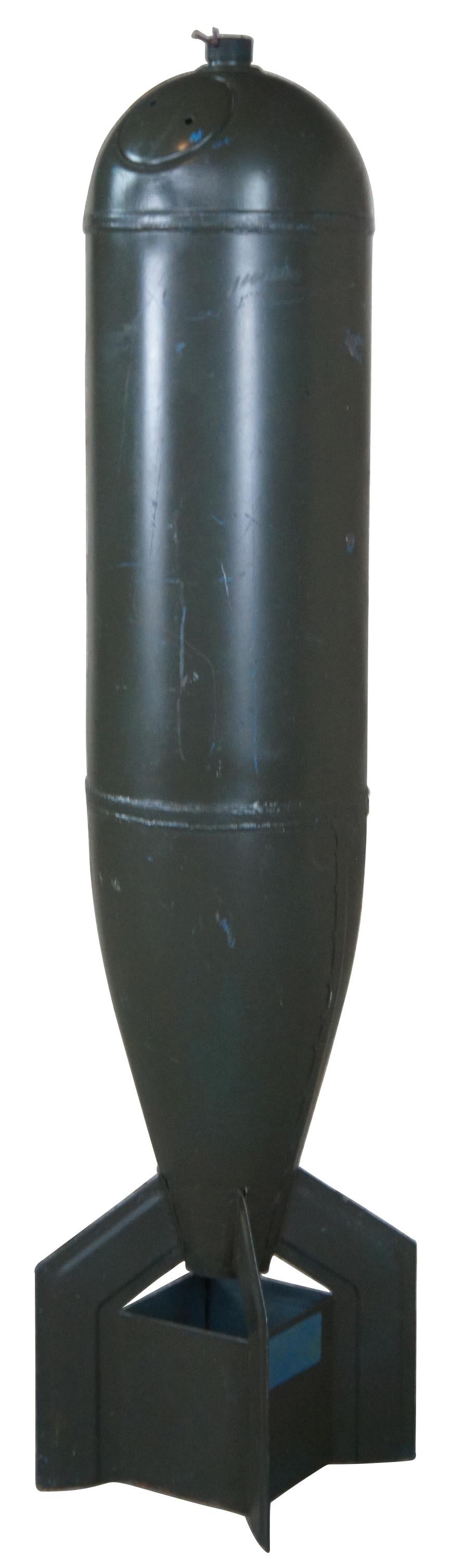 Mk15 mod 4 military Practice bomb, circa mid 20th century. These were originally filled with water and sand used by the Navy for target practice. Impact fired signal-generating practice bombs. The bomb itself weighs roughly about 20 pounds, with