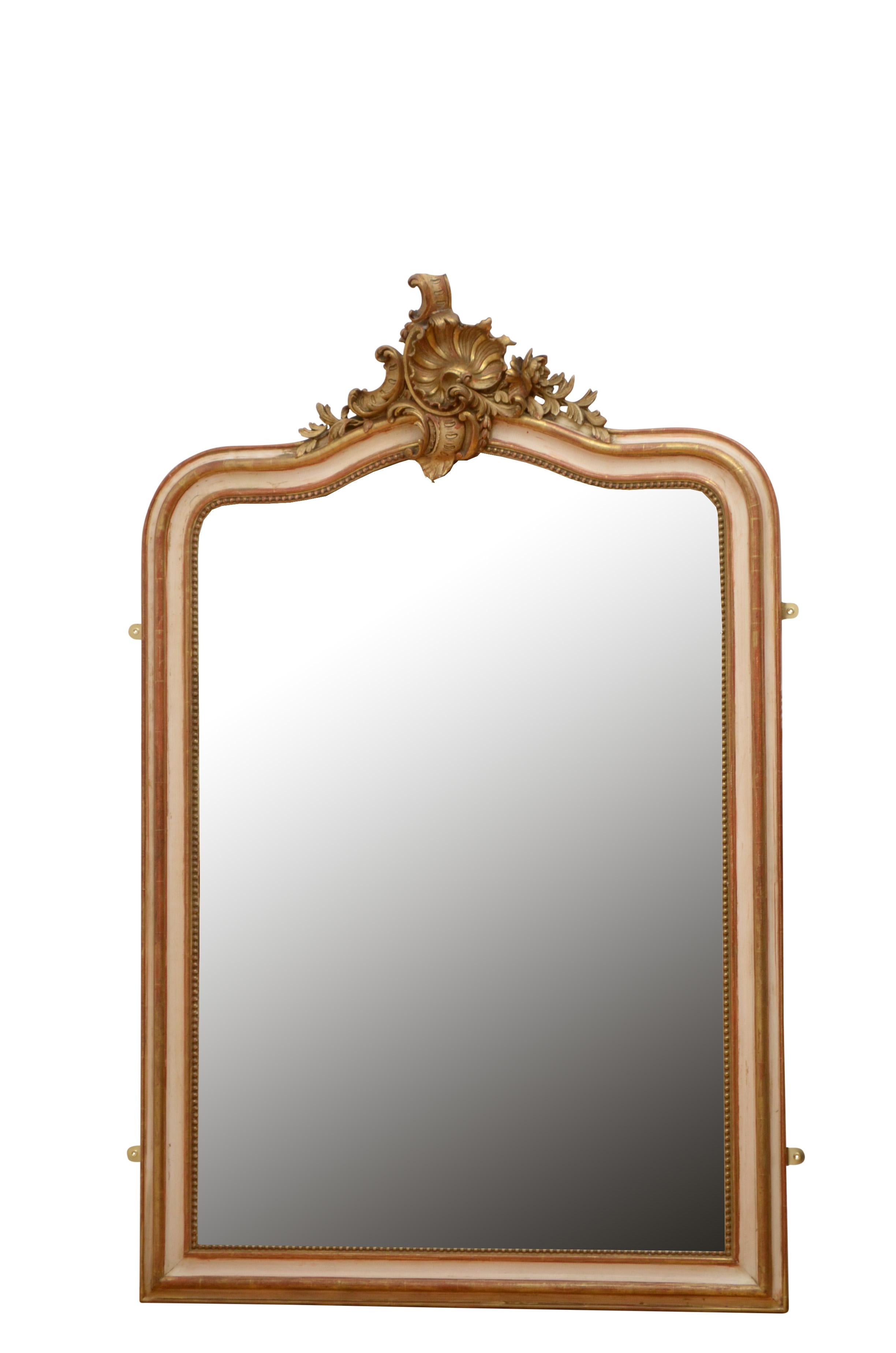 K0467 Beautiful French, cream and gold leaf wall mirror, having original bevelled edge glass with some foxing in beaded and shaped frame with shell and floral centre crest to the top. This antique mirror retains its original glass, original gold