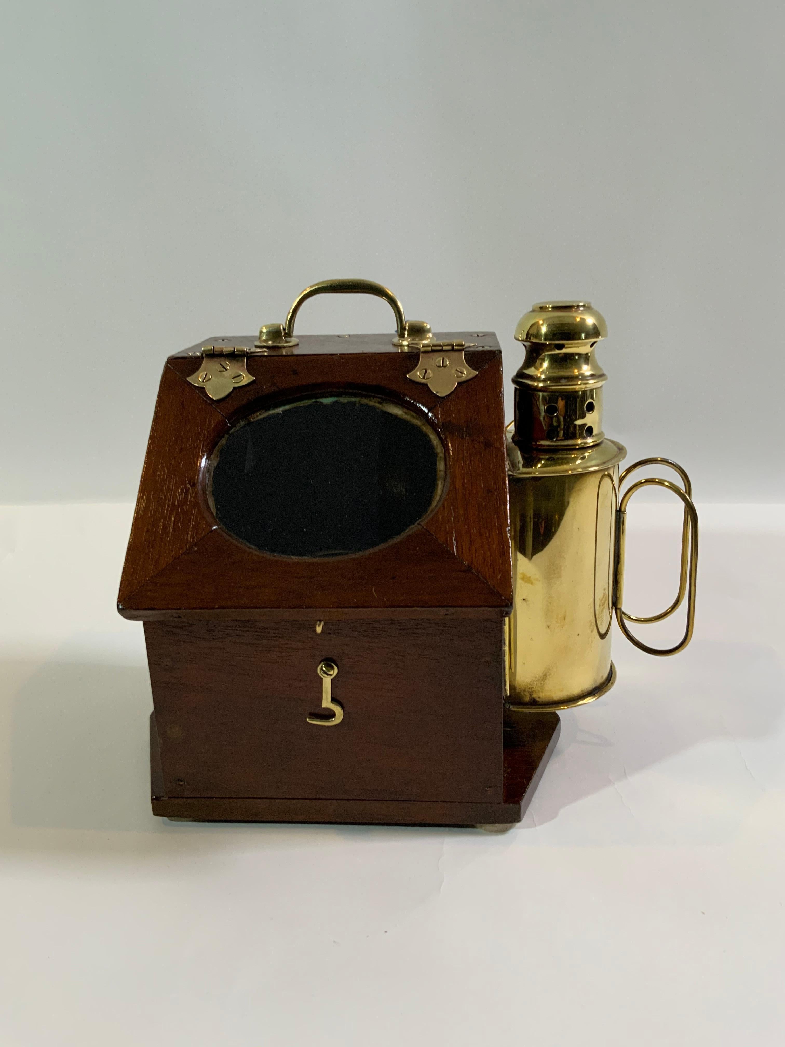 Boat compass in binnacle with hinged lid, sidelight, brass hook, etc. Very fine condition. Gimballed compass is by Polaris. Great piece.

Overall dimensions: 11