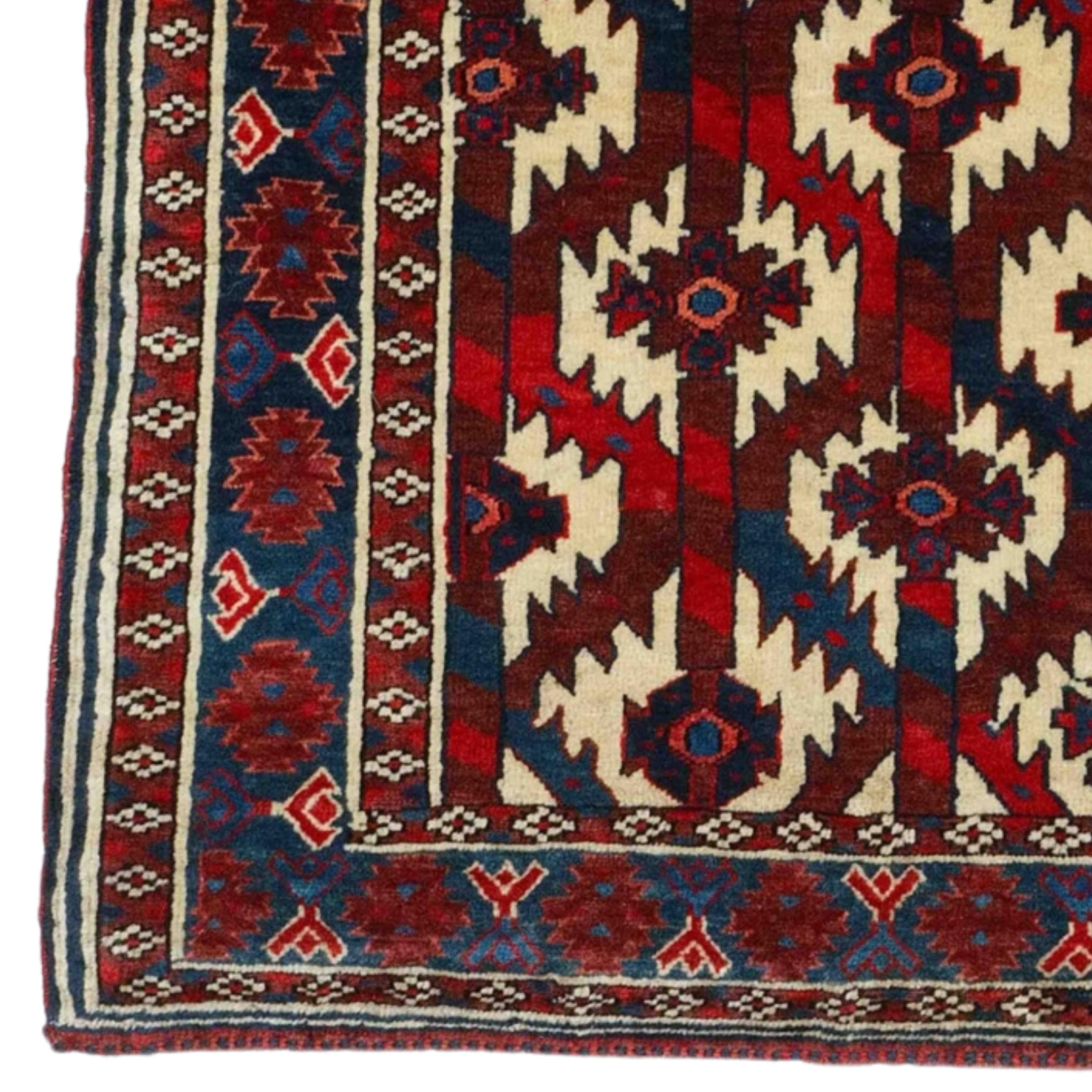 This elegant 19th century Yamud Hanging carpet is a work of art that will enrich any space with its carefully chosen color palette and sophisticated patterns. Offering the harmony of red, blue and white, this antique piece is a reflection of