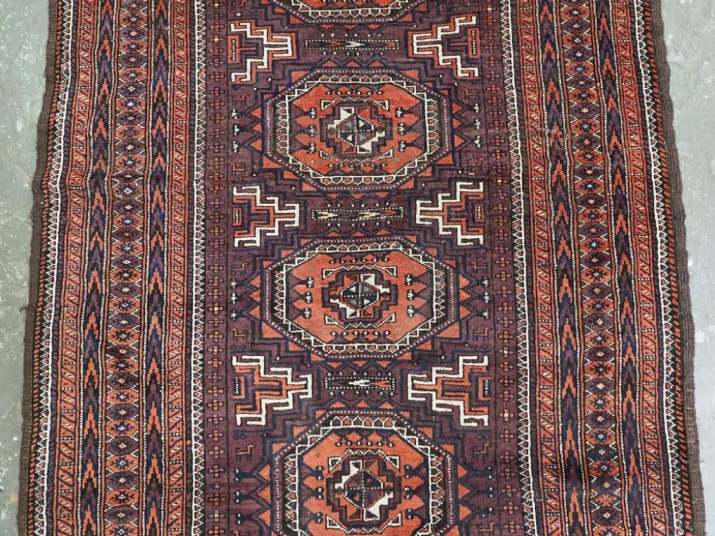 Antique Yaqoub Khani Baluch Rug, Octogen Design On Aubergine Ground, Circa 1900 In Good Condition For Sale In Moreton-In-Marsh, GB