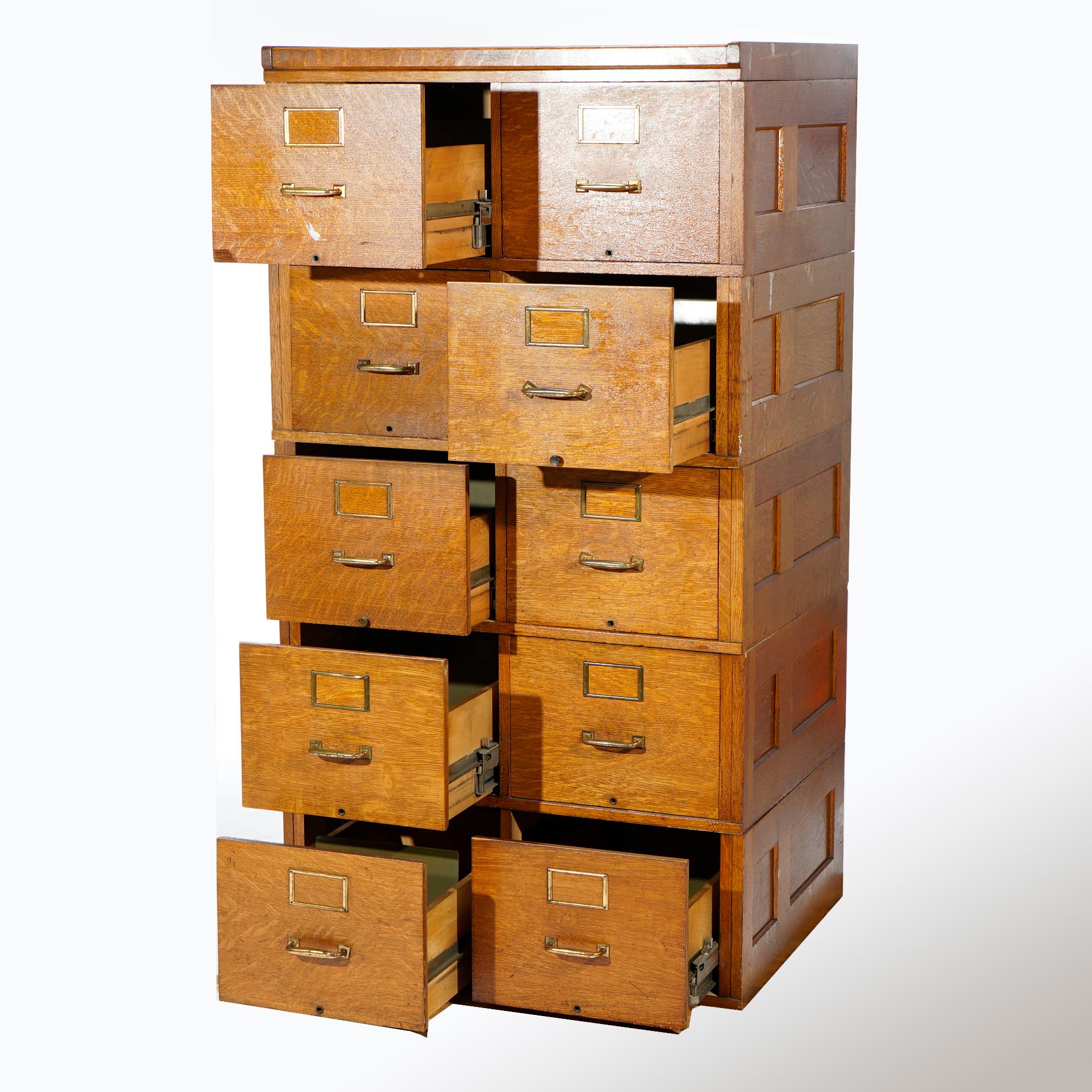 An antique Arts & Crafts file cabinet by Yawman offers paneled oak construction with ten filing drawers (two columns with five drawers each), maker label as photographed, c1900.

Measures- 61.5''H x 33''W x 26.25''D.

Catalogue Note: Ask about