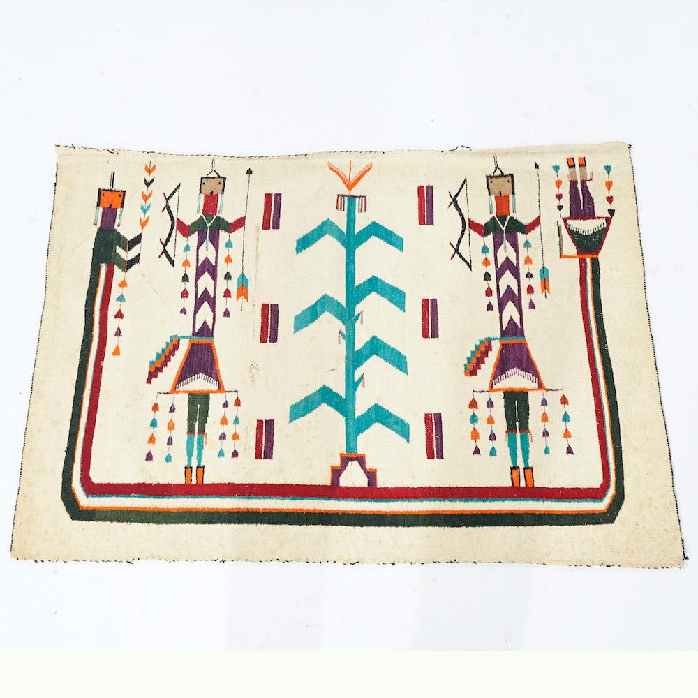 An antique Southwestern Navajo Yei rug offers wool construction with figures and corn, circa 1910

Measures- 32''L x 43.5''W x .5''D.