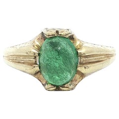 Bague ancienne en or jaune avec émeraude cabochon et solitaire gravée à la main