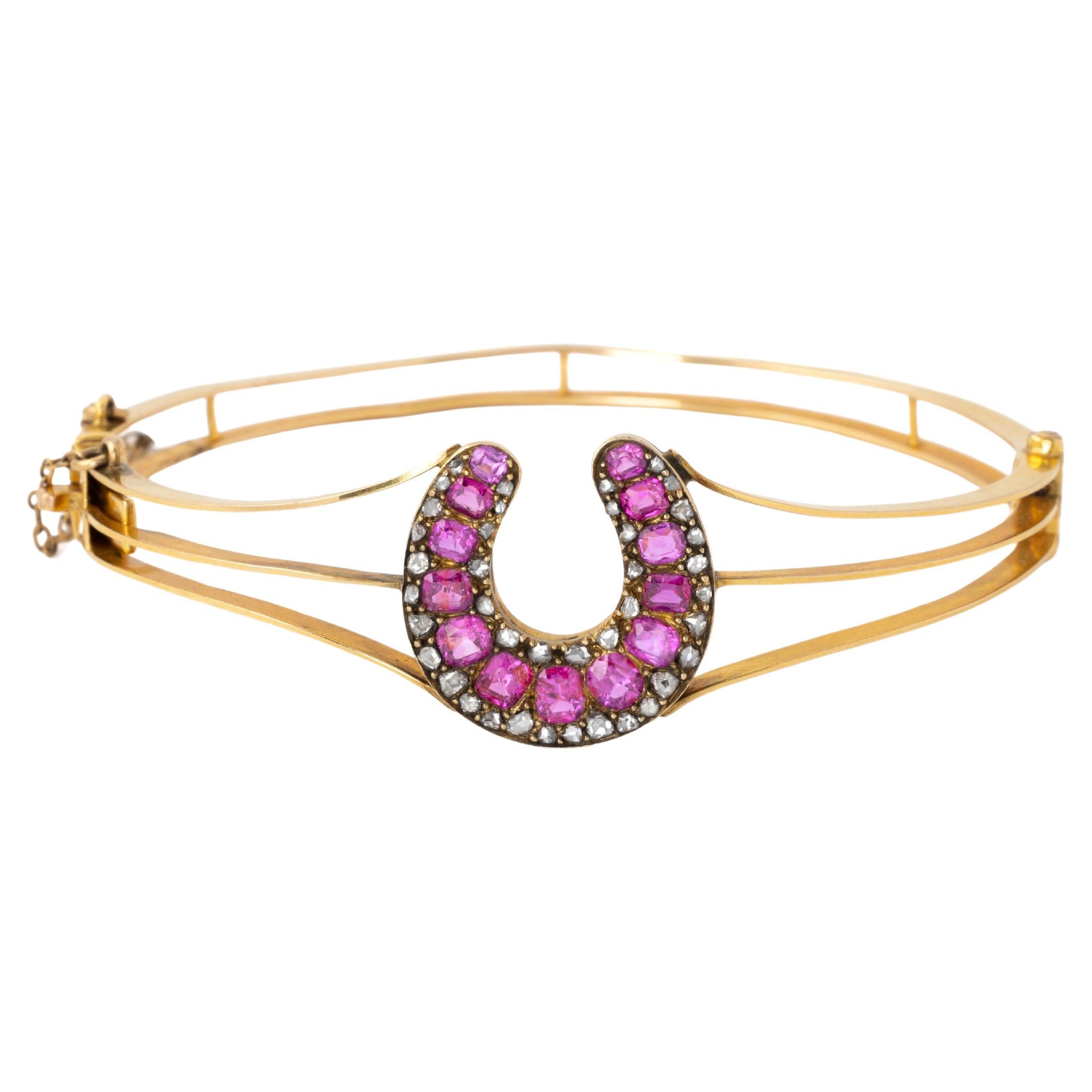 Brazalete de herradura antiguo de oro amarillo y rubíes y diamantes