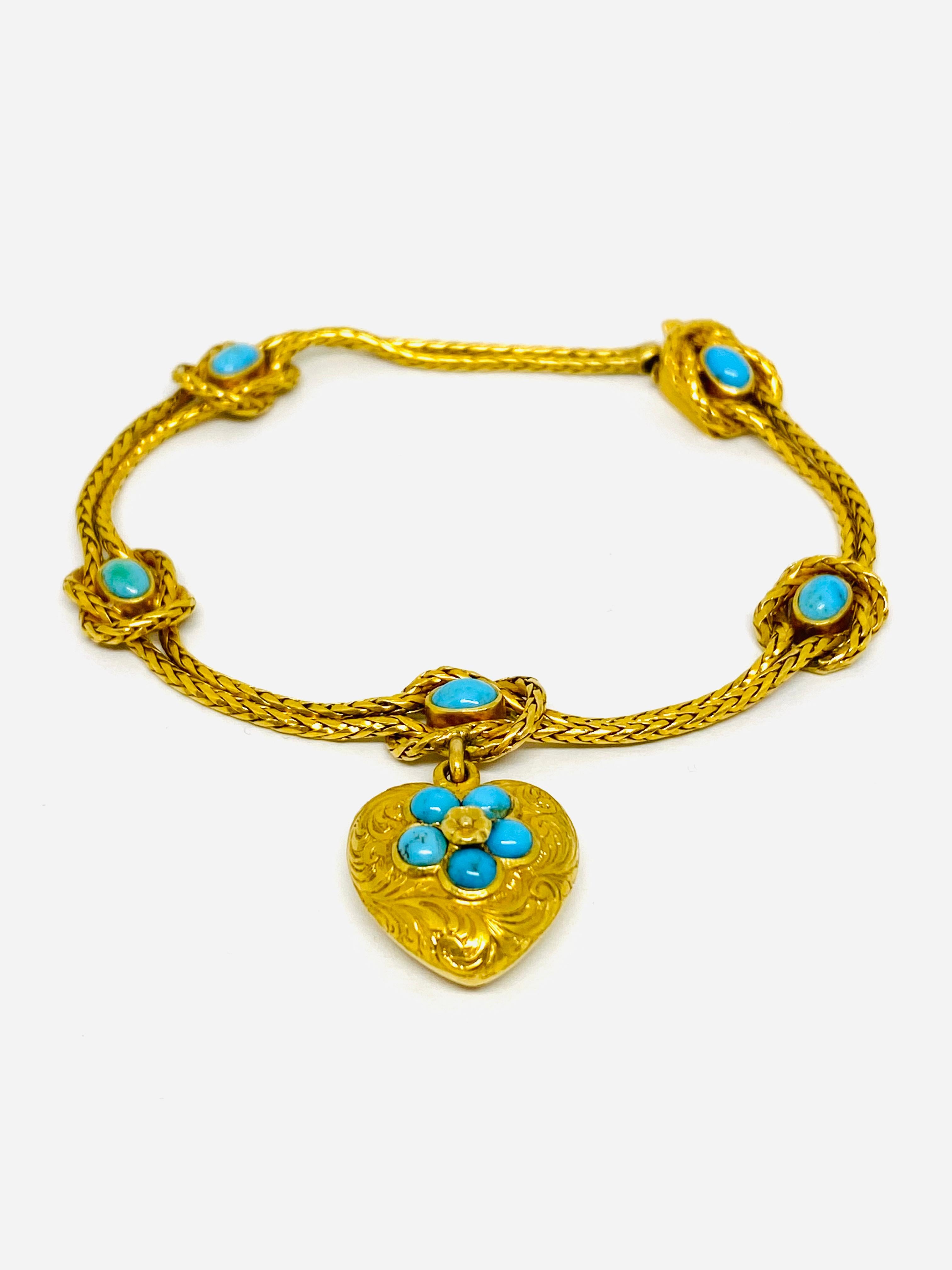 Product details:
Circa 1900's
18K Yellow Gold and Turquoise
Featuring double braided chain with leaf and flower motif heart charm/ pendant 
Total weight is 18.0 grams