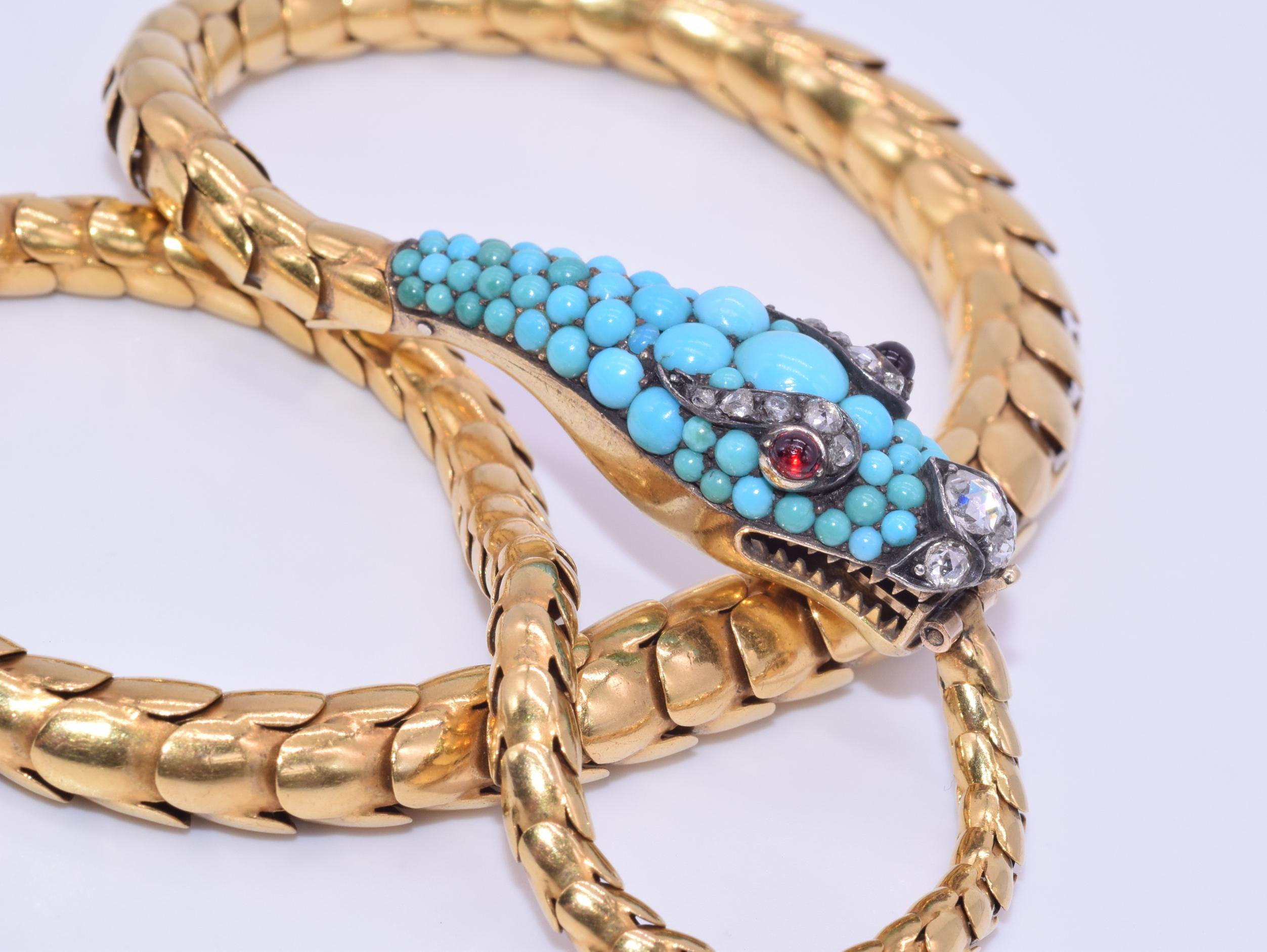 Convertible Antique Yellow Gold and Turquoise Snake Necklace

A snake necklace features a turquoise set head accented with rose cut diamonds totaling approximately 0.55 carat with garnet eyes mounted in 18 karat yellow gold. Snake head: 1.5in