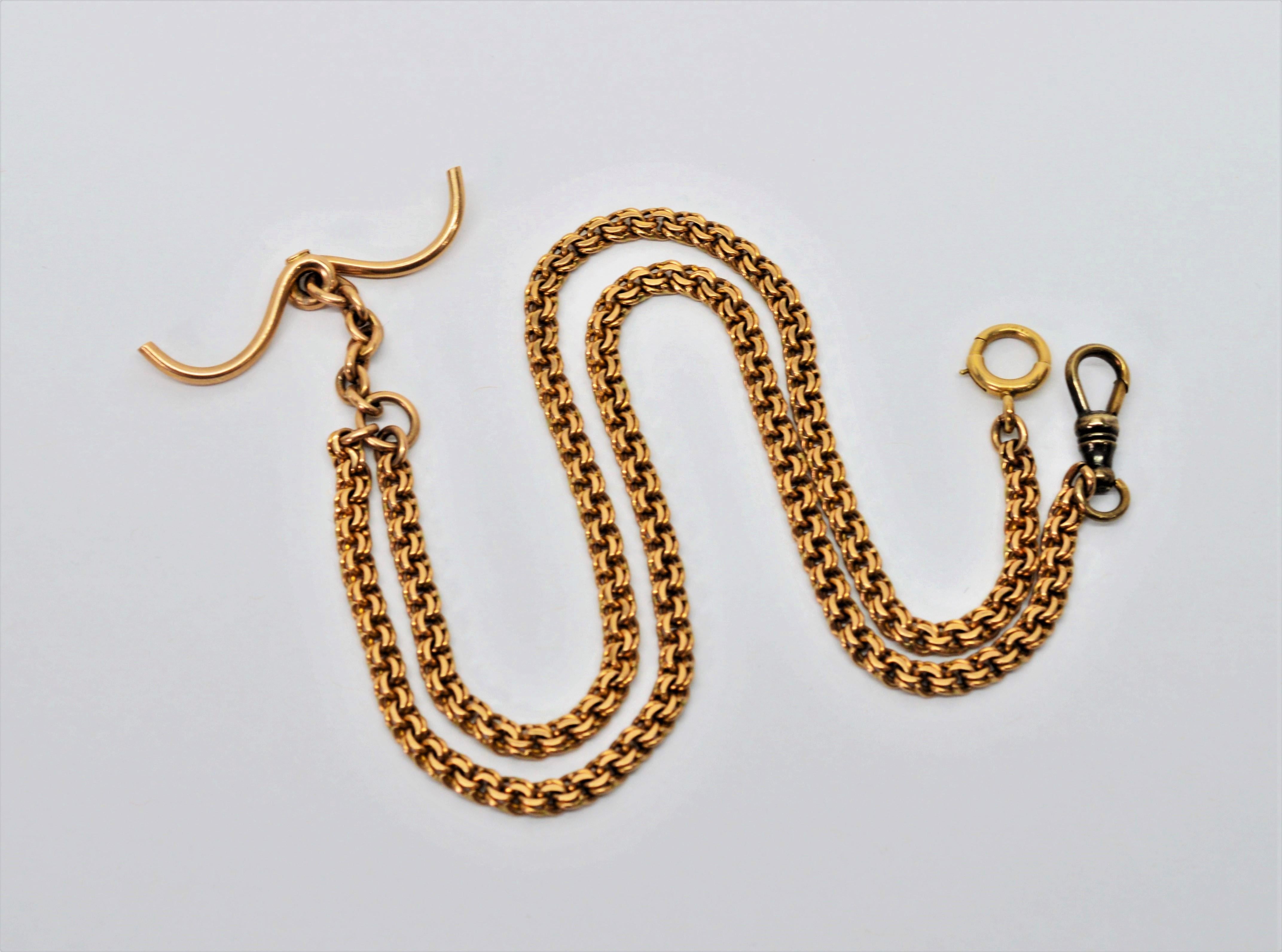 Twenty inch antique  4.16mm double link flat curb chain for pocket watch in twelve carat 12K yellow gold. In fine condition, has curved style pocket T-Bar, measuring 1-6/8 inch across. Fitted with a swivel dog clip and spring ring. Gift boxed.