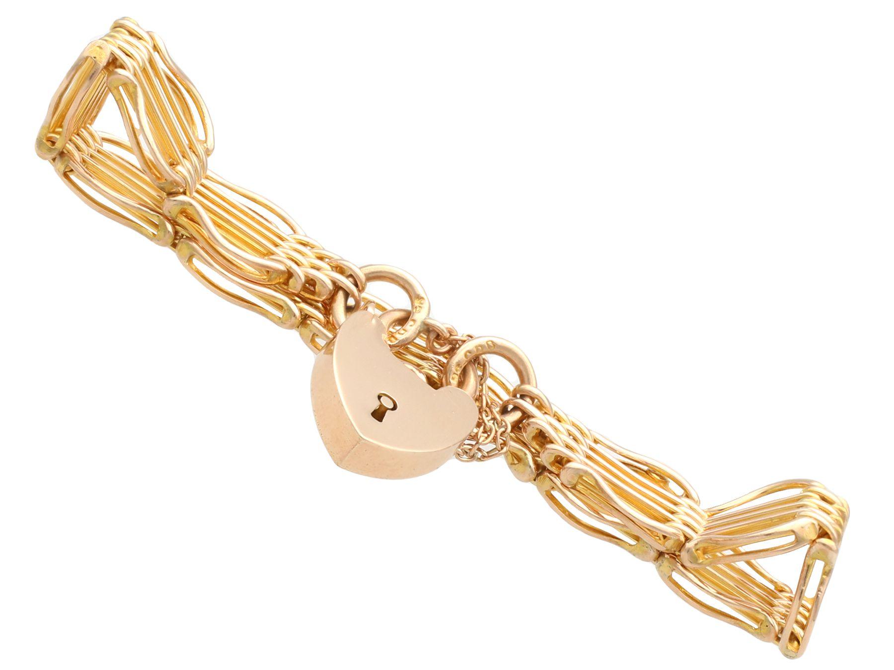 An exceptional, fine and impressive 9 karat yellow gold heart padlock 5 bar gate bracelet; part of our diverse antique jewellery collections.

This exceptional, fine and impressive antique bracelet has been crafted in 9k yellow gold.

The gate