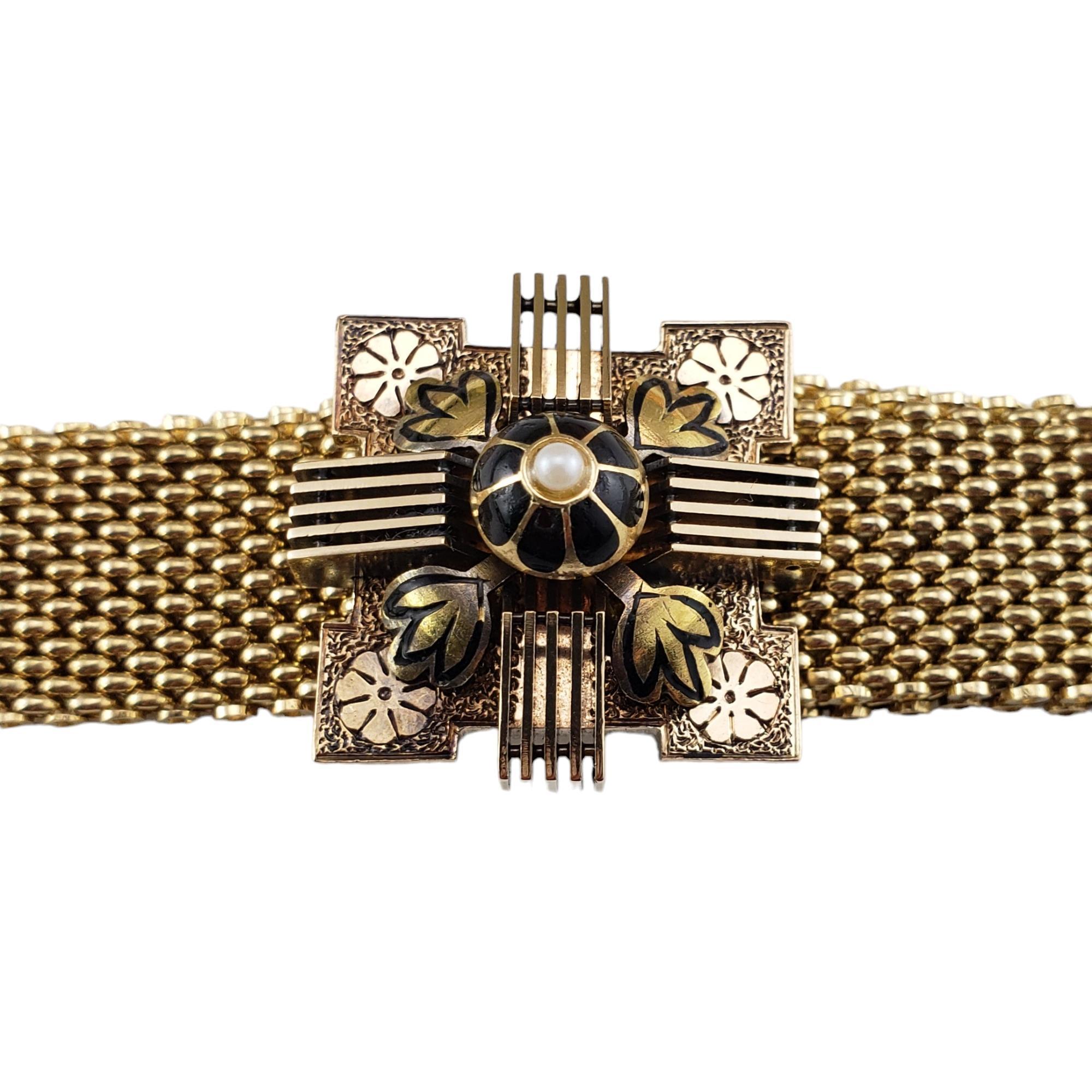 Antique Yellow Gold Mesh Slide Bracelet-

This spectacular mesh bracelet is capped with a fringed tassel and crowned with a decorative slide for which to adjust the bracelet length.  Accented with black enamel and two white pearls.

Slide width: 26