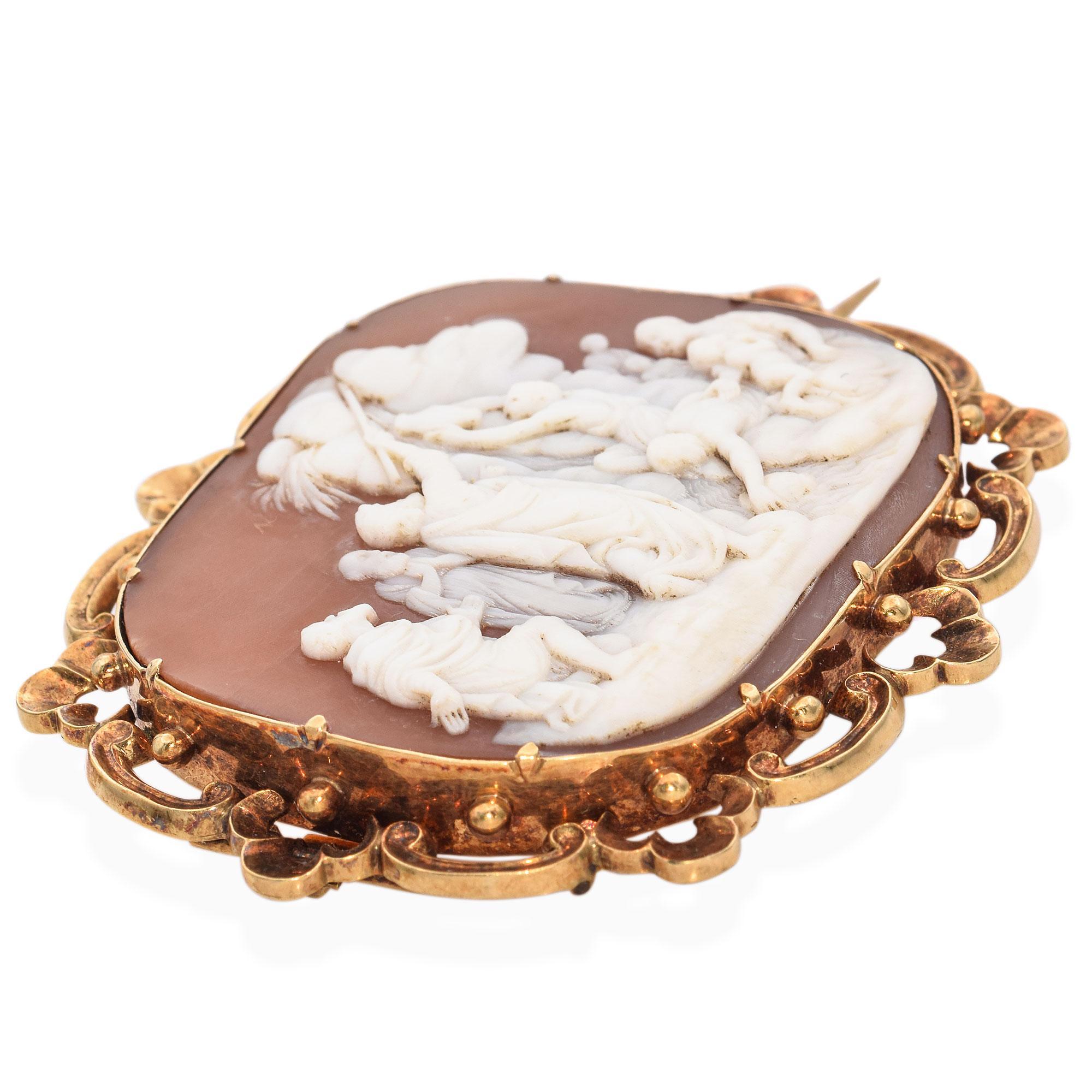 A late 19th-century brooch, intricately carved with a detailed scene of Moses Parting the Sea. The piece features a rectangular cameo with a scalloped gold frame, showcasing exquisite craftsmanship.

Weight: 17.7 grams 
Stone: Sardonyx
